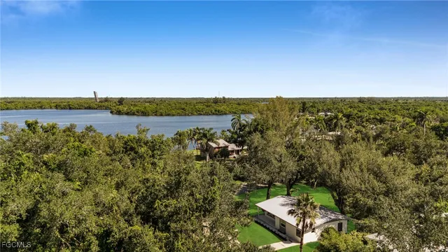 a view of a lake with houses in the back