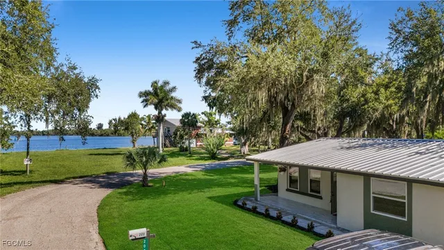 a view of a house with a backyard