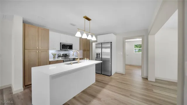 a view of a kitchen stove and a refrigerator