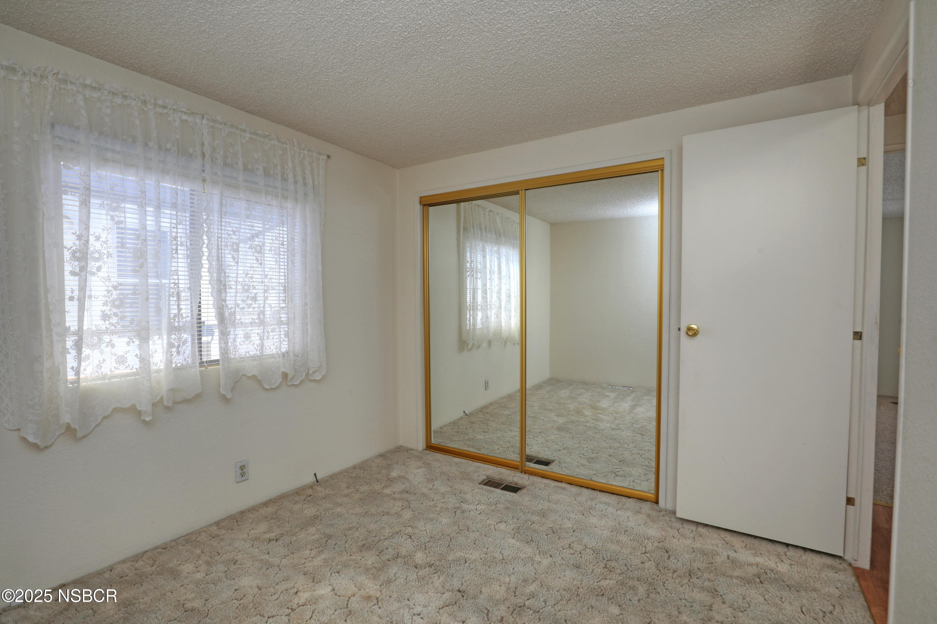 80 Zaca Street, Unit 4 Buellton, CA 93427 - Photo 11 of 25 a view of an empty room with window