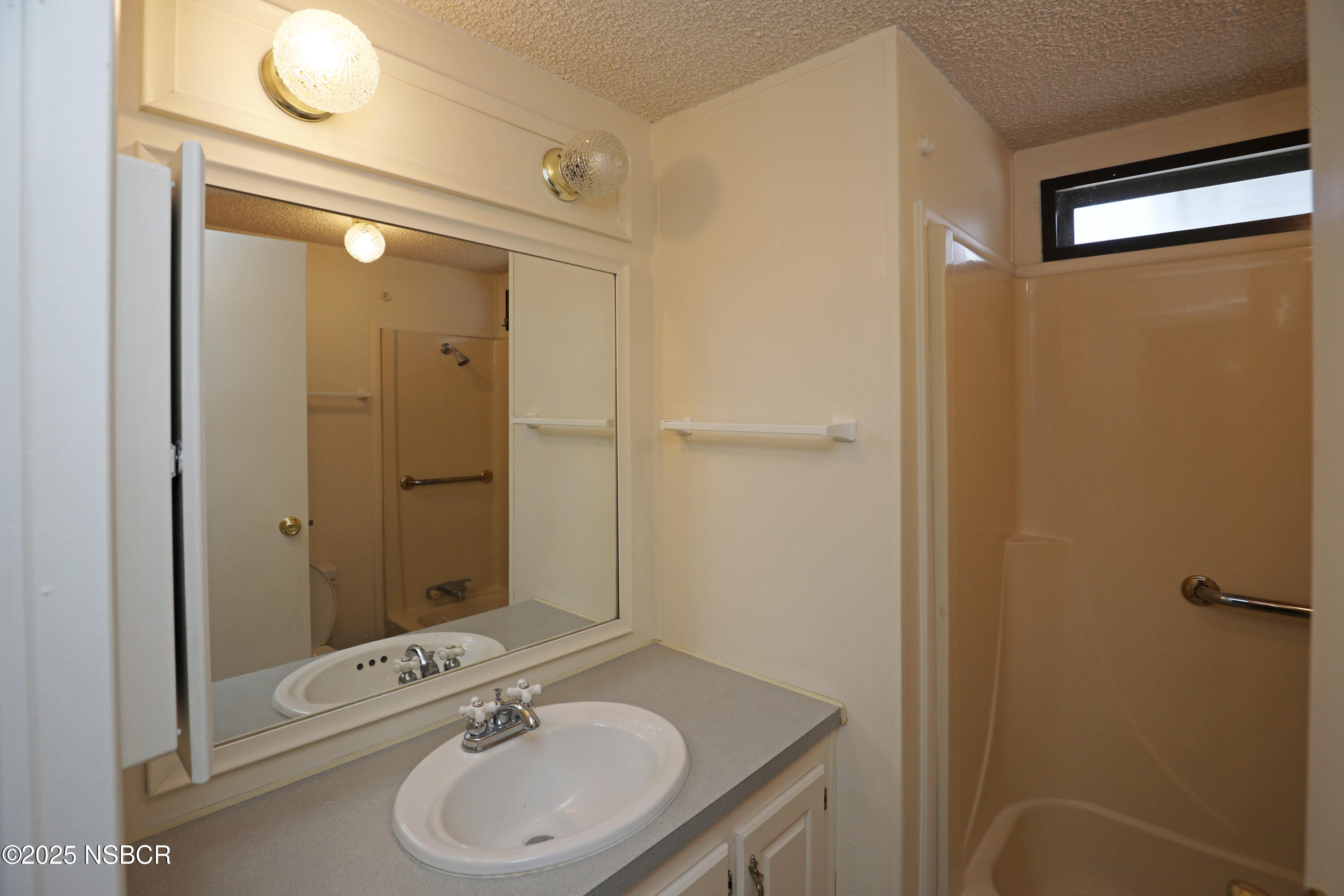 80 Zaca Street, Unit 4 Buellton, CA 93427 - Photo 12 of 25 a bathroom with a sink a toilet and shower