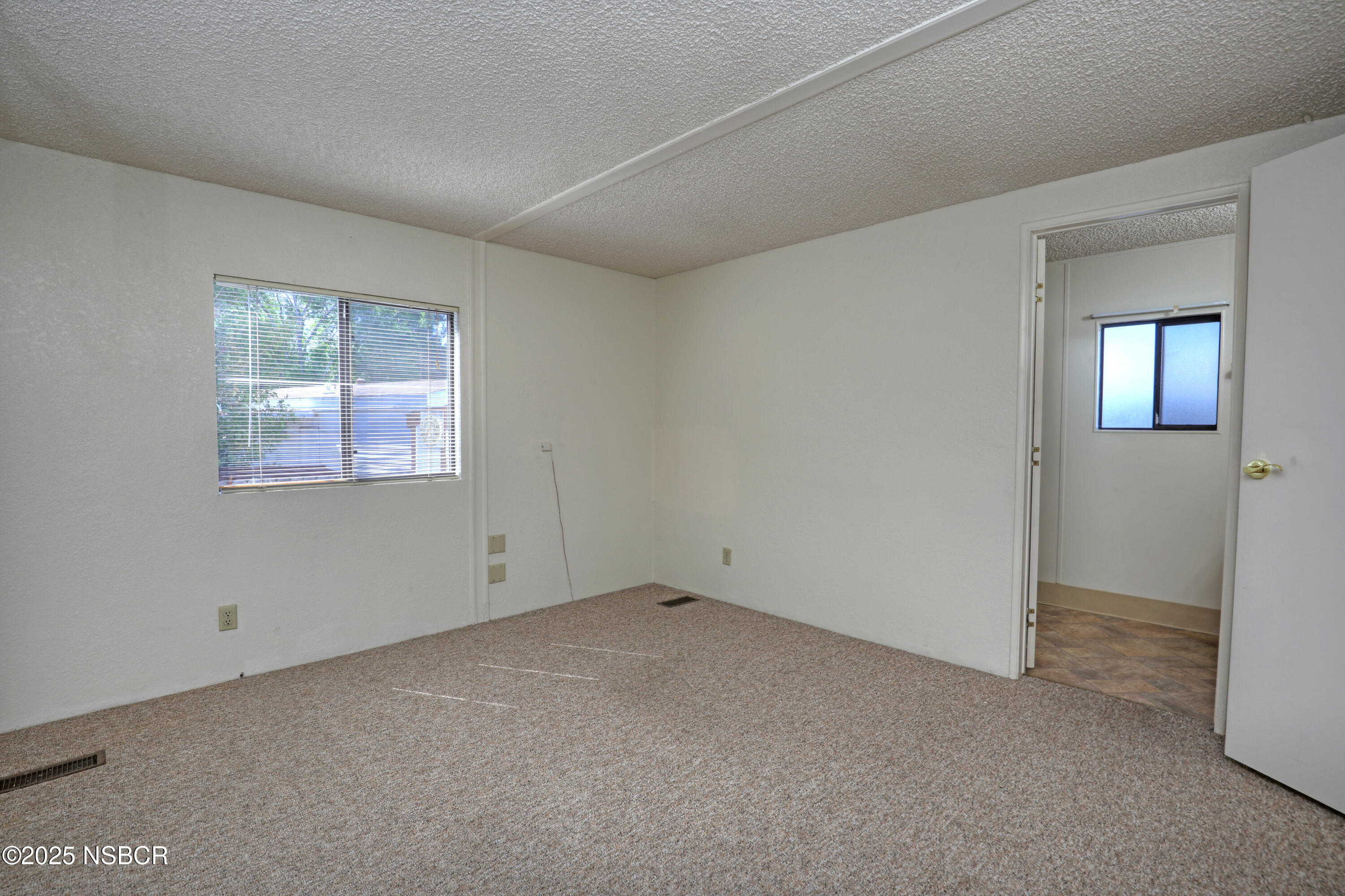 80 Zaca Street, Unit 4 Buellton, CA 93427 - Photo 14 of 25 an empty room with windows