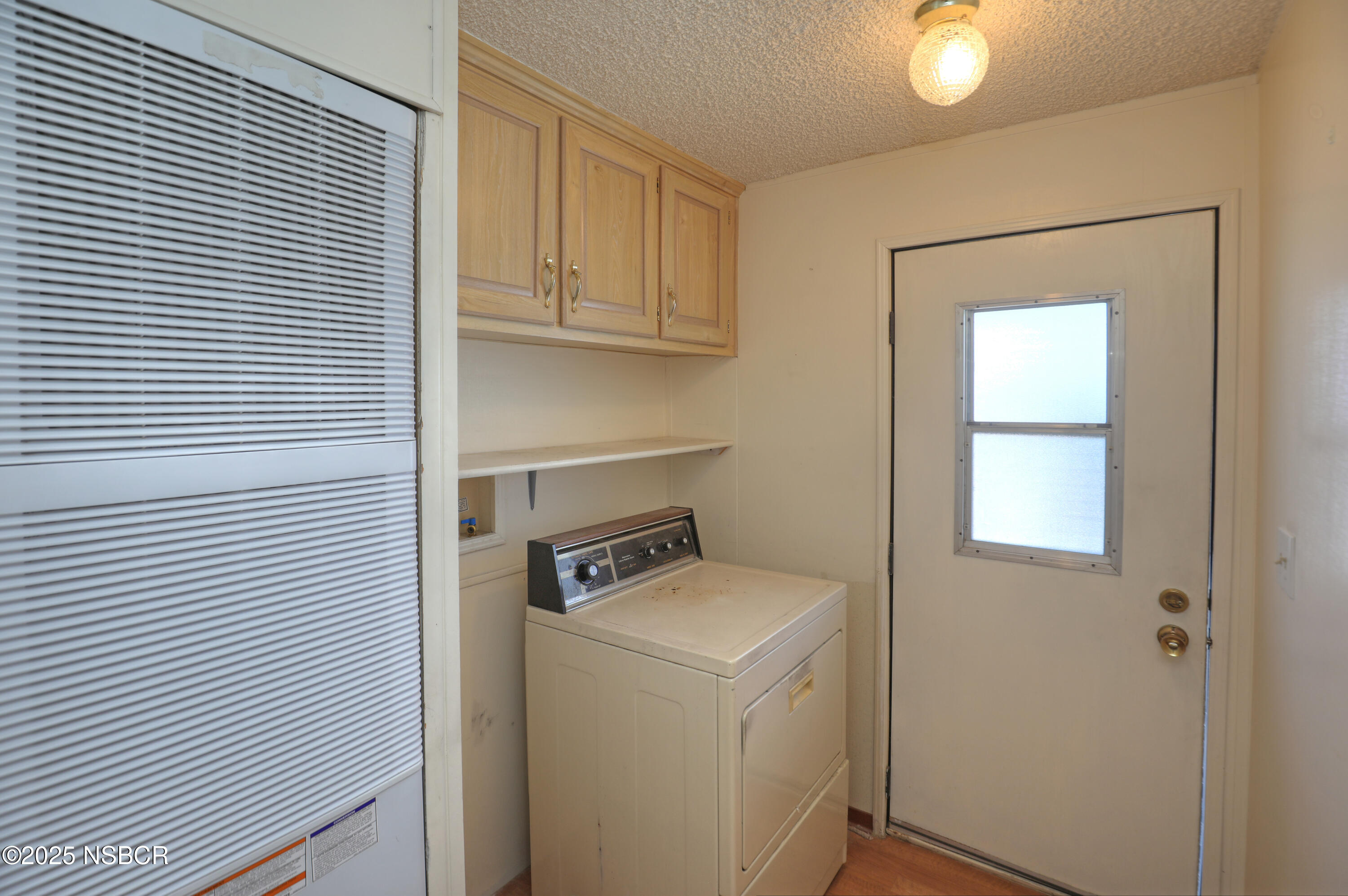 80 Zaca Street, Unit 4 Buellton, CA 93427 - Photo 18 of 25 a utility room with dryer and washer