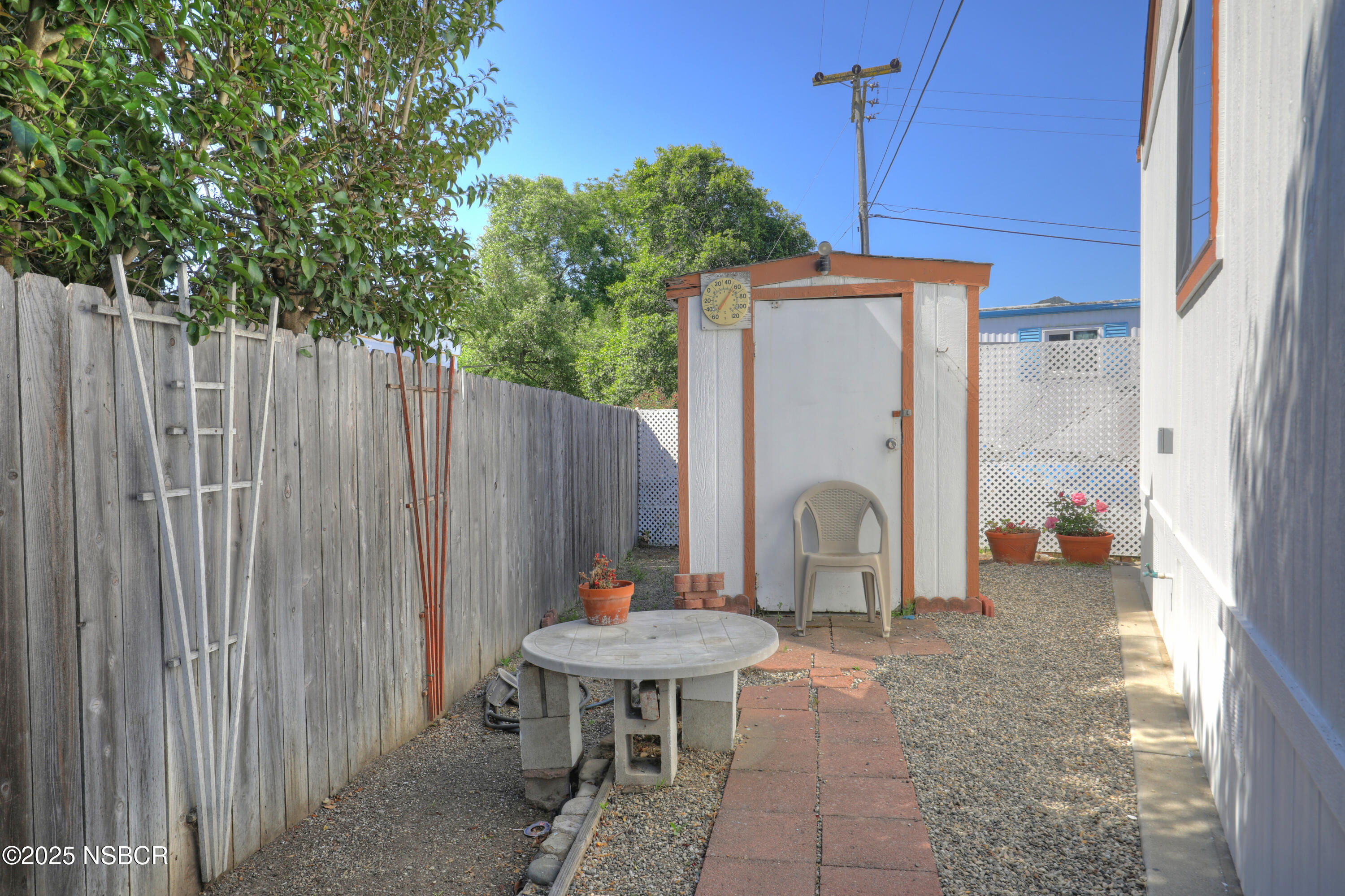80 Zaca Street, Unit 4 Buellton, CA 93427 - Photo 19 of 25 a backyard of a house with table and chairs