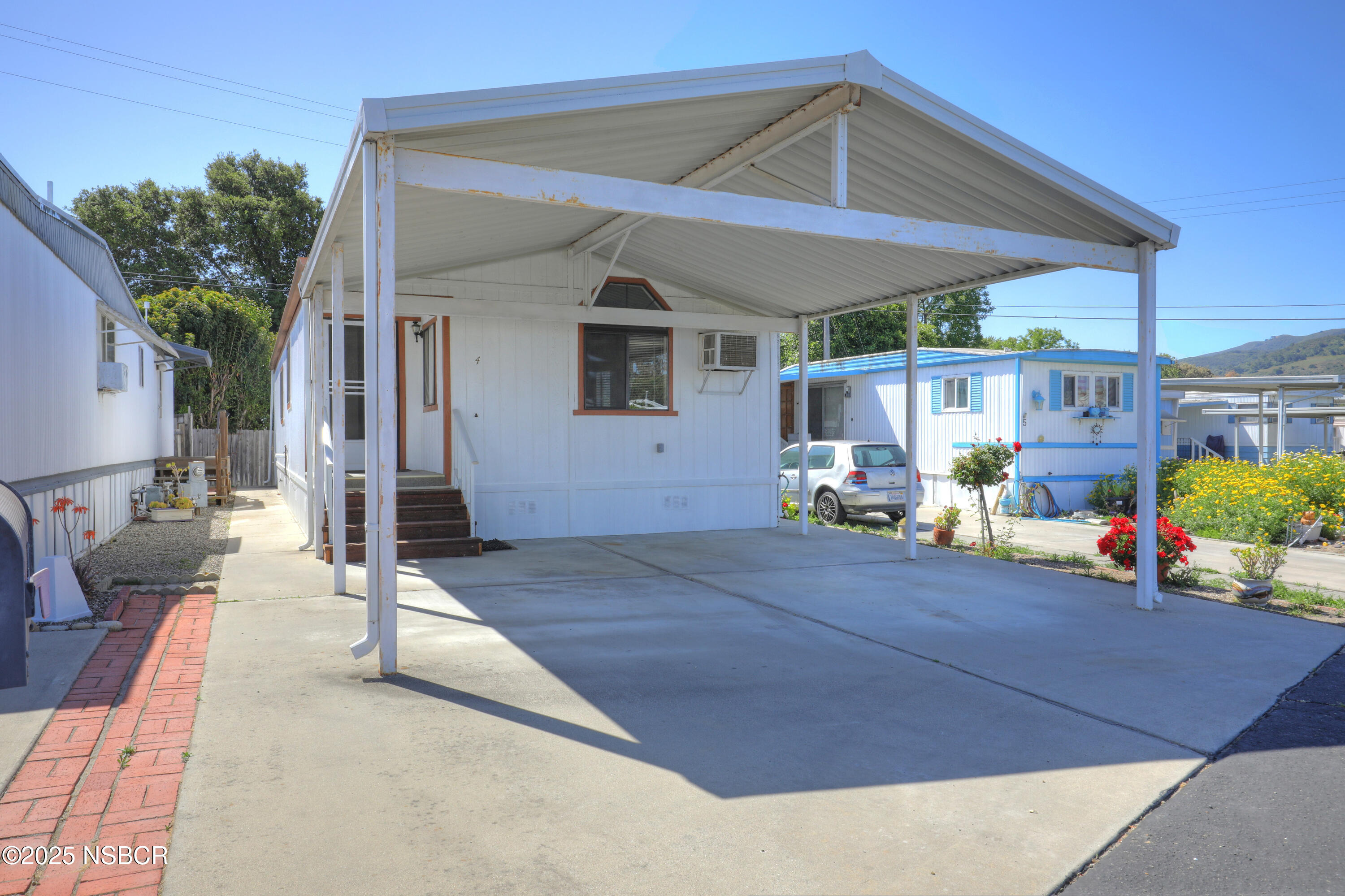 80 Zaca Street, Unit 4 Buellton, CA 93427 - Photo 2 of 25 a backyard of a house with seating space