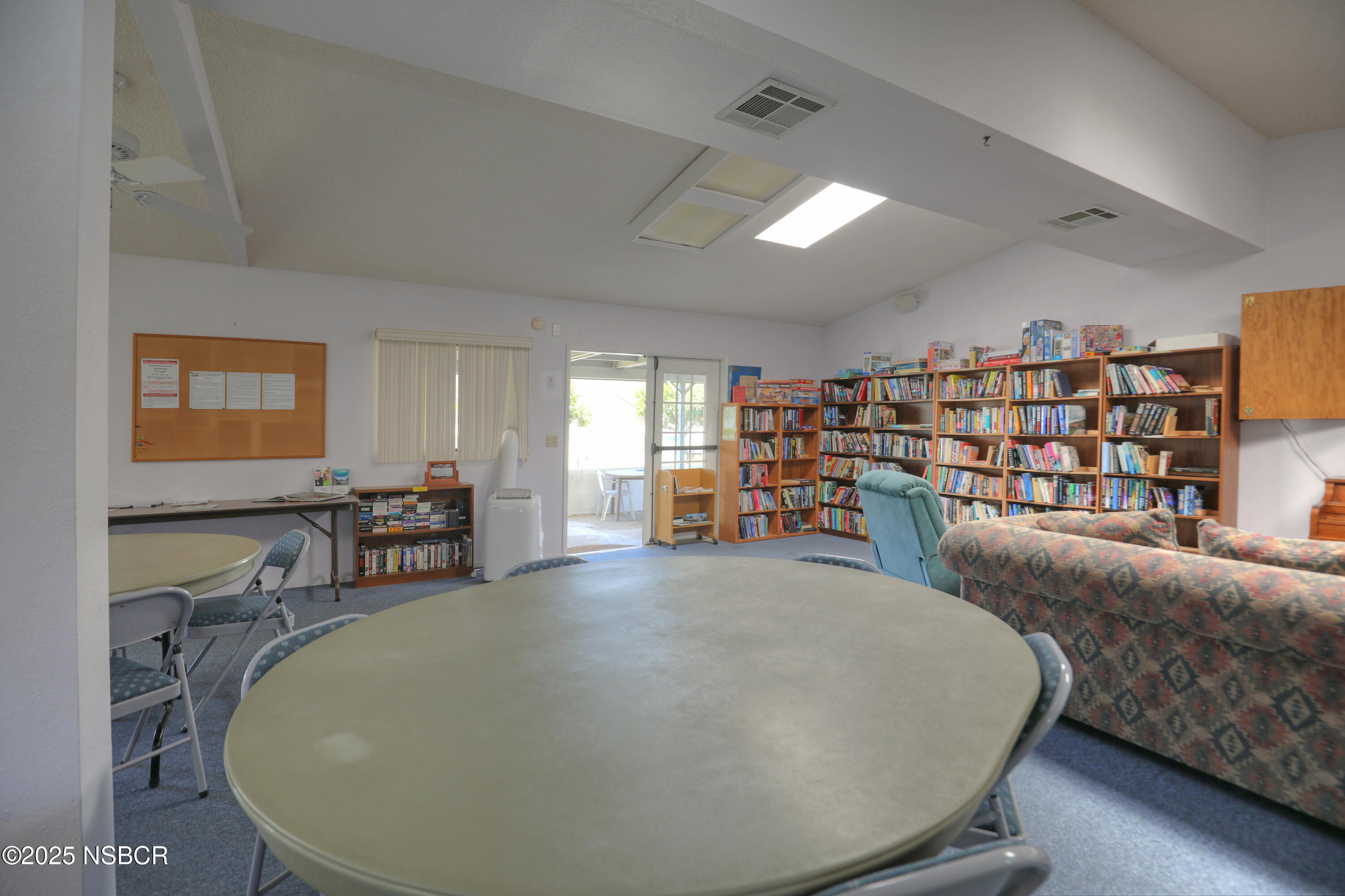 80 Zaca Street, Unit 4 Buellton, CA 93427 - Photo 24 of 25 a living room with furniture and a flat screen tv