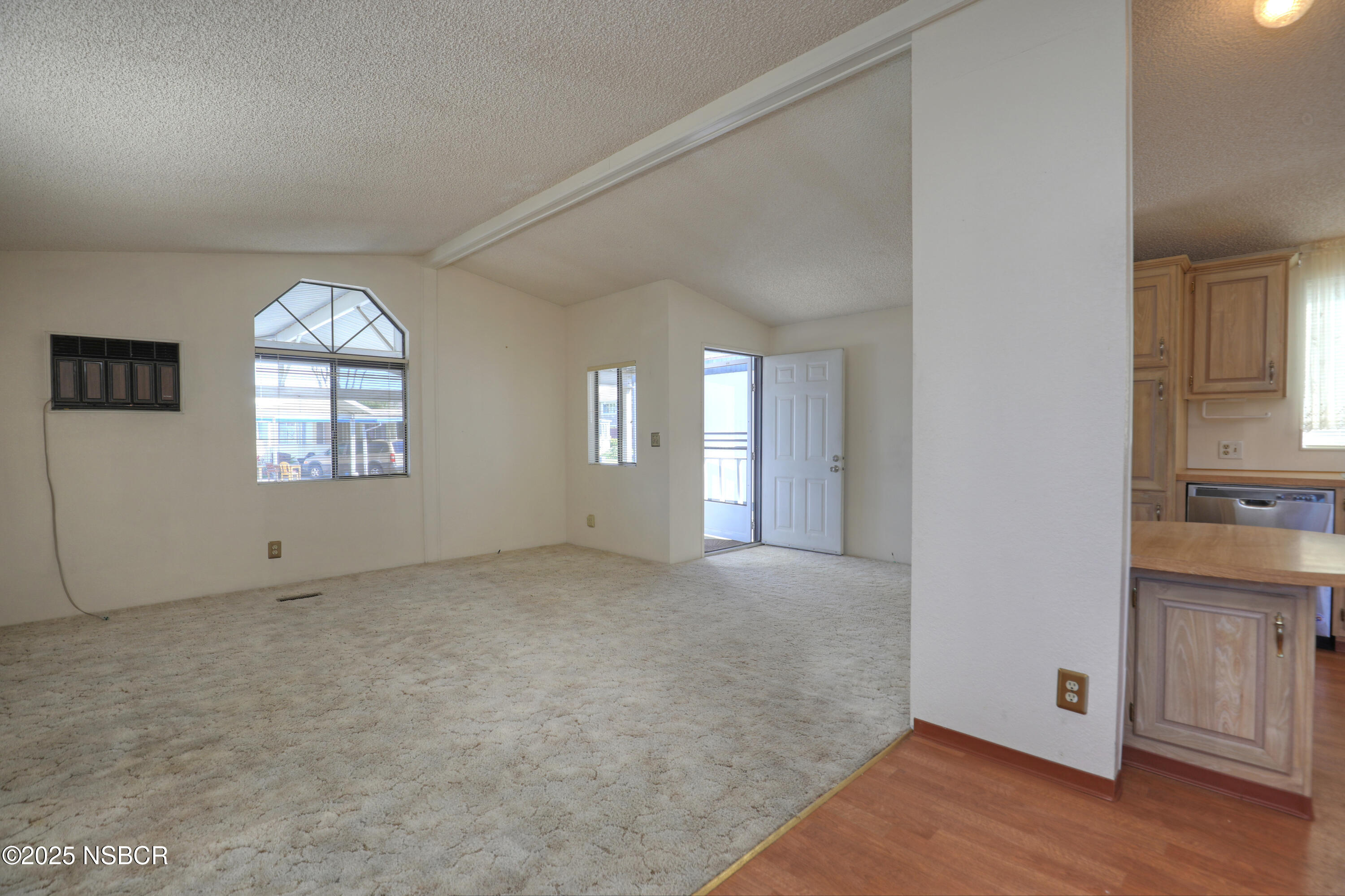 80 Zaca Street, Unit 4 Buellton, CA 93427 - Photo 4 of 25 a view of an empty room with window and wooden floor