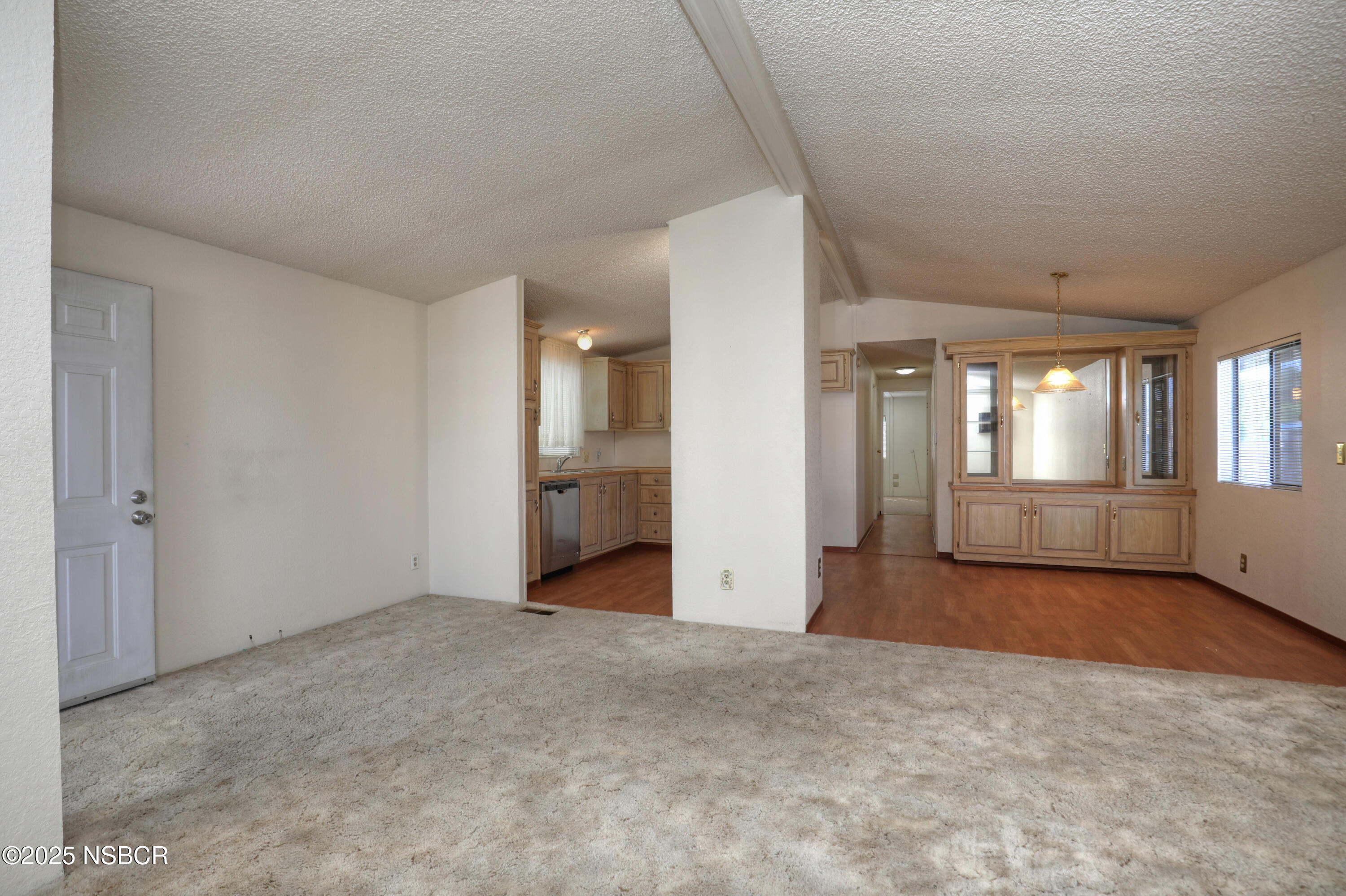 80 Zaca Street, Unit 4 Buellton, CA 93427 - Photo 5 of 25 a view of an empty room with large windows