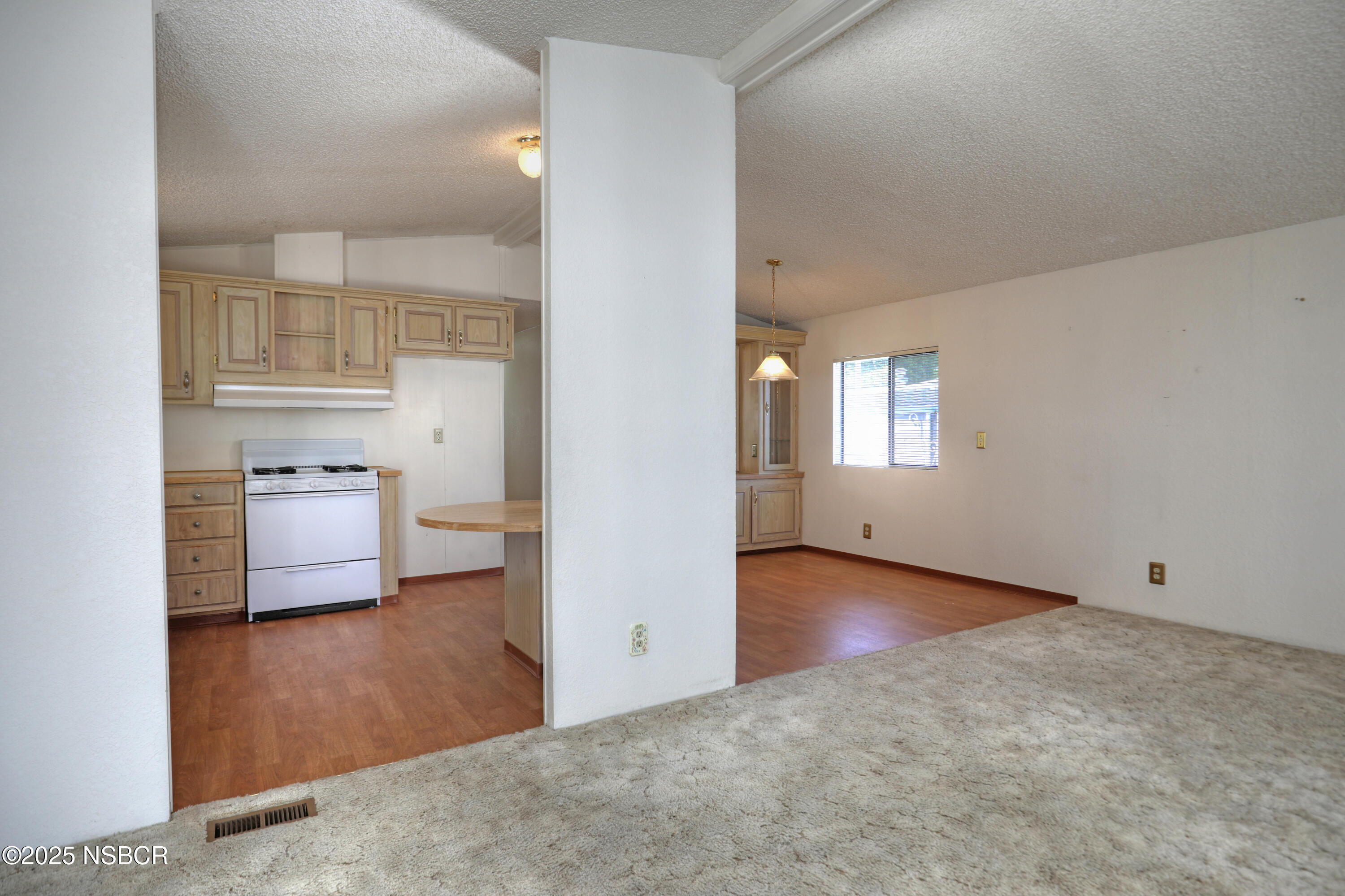 80 Zaca Street, Unit 4 Buellton, CA 93427 - Photo 6 of 25 wooden floor in an empty room and a window