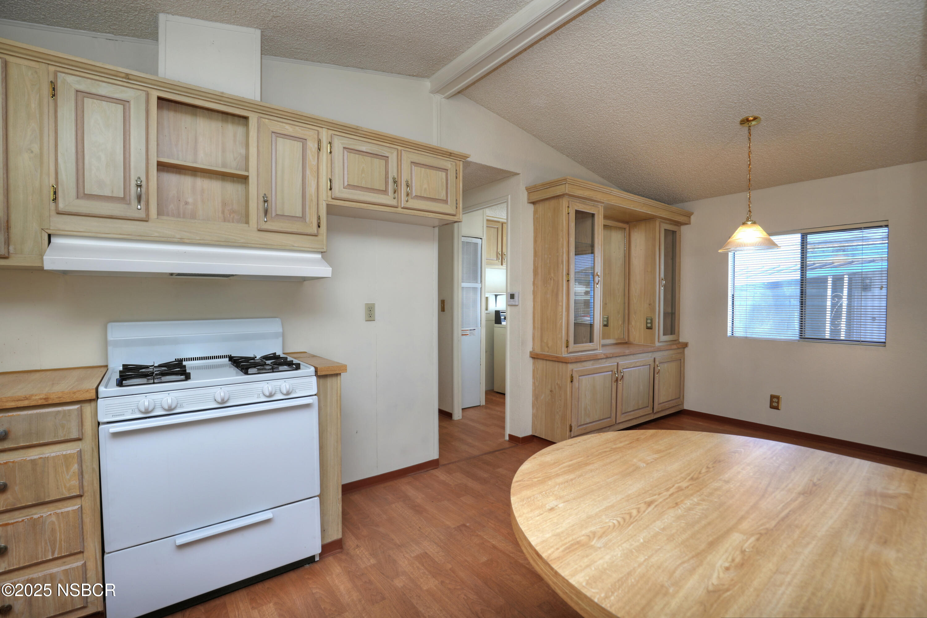 80 Zaca Street, Unit 4 Buellton, CA 93427 - Photo 8 of 25 a kitchen with white cabinets and sink