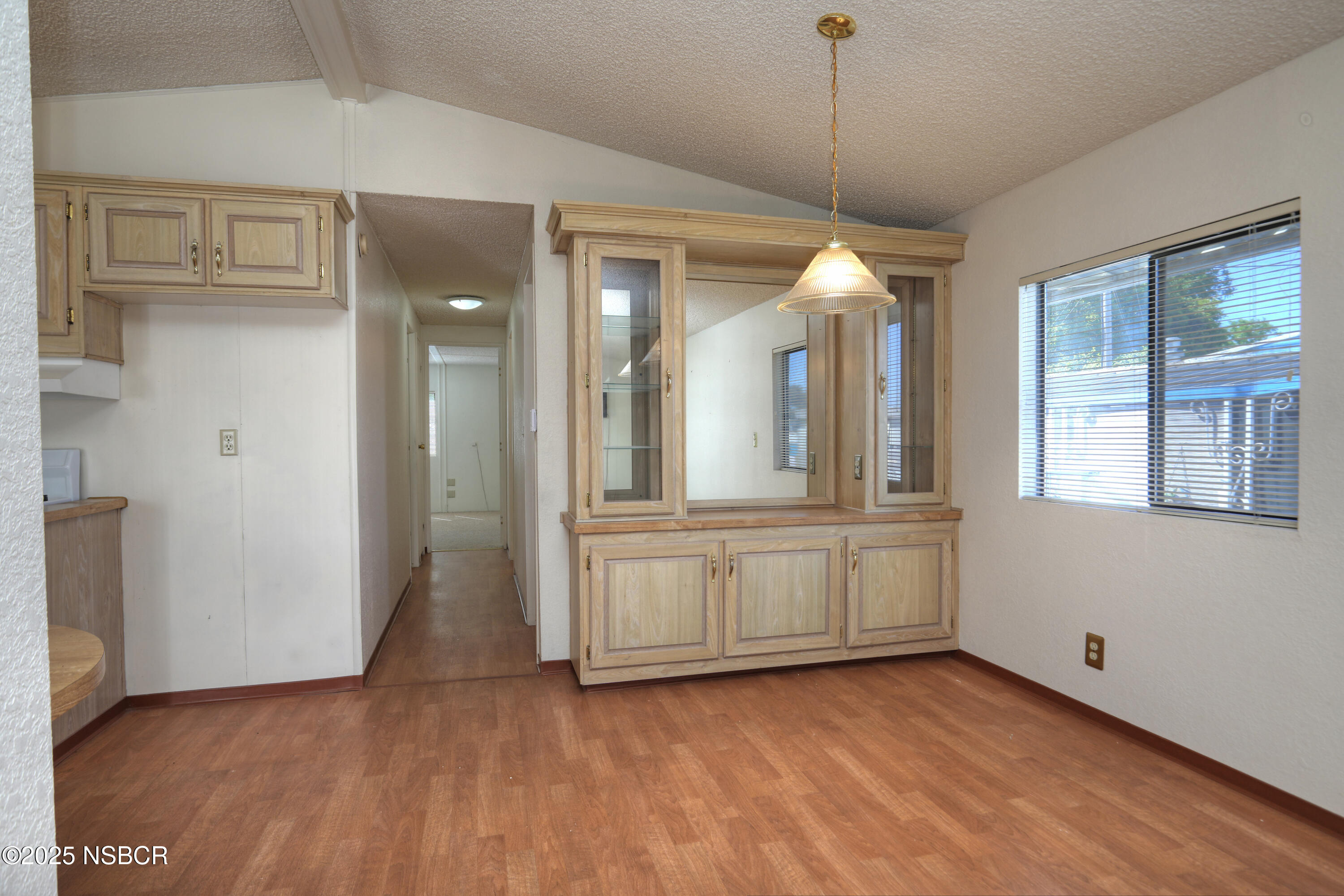 80 Zaca Street, Unit 4 Buellton, CA 93427 - Photo 9 of 25 a view of a room with wooden floor and window