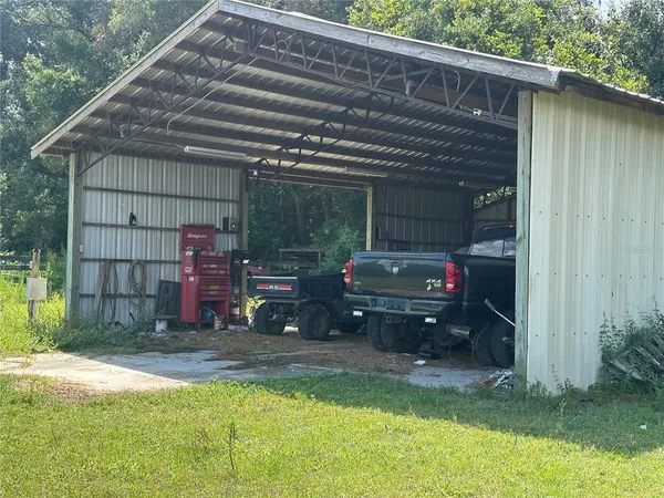a view of backyard with cabin