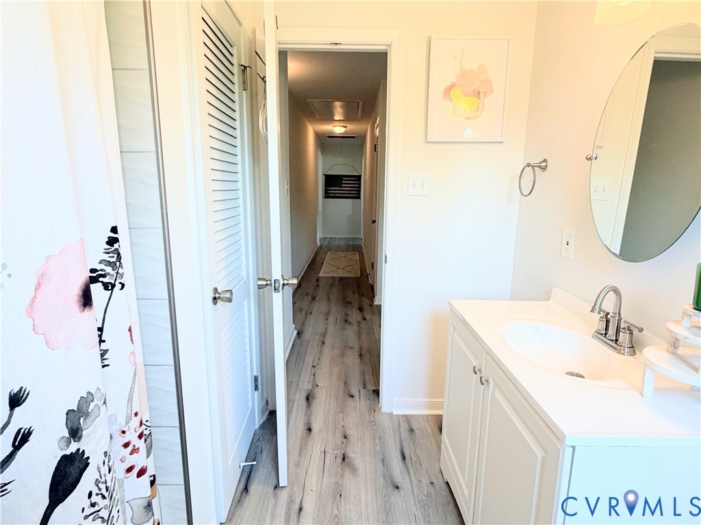 7547 Media Park Road Henrico, VA 23231 - Photo 12 of 21 Bathroom featuring a white vanity with an integrat