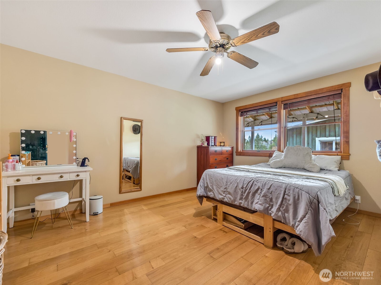 20003 Sandridge Road Long Beach, WA 98631 - Photo 19 of 39 a bedroom with a bed and a chandelier