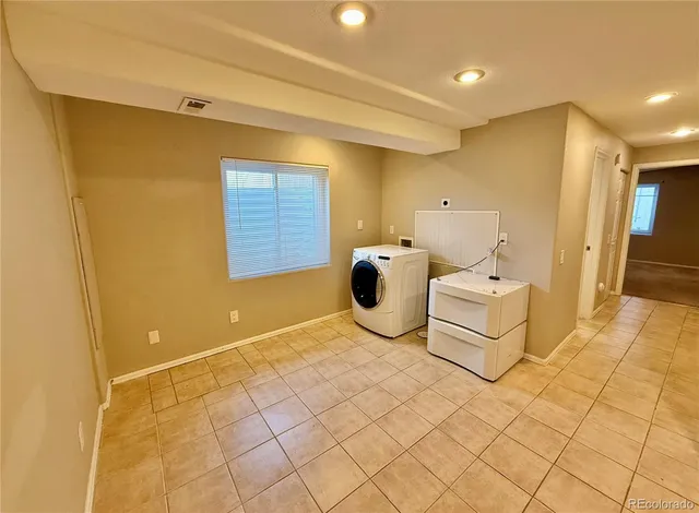 a spacious bathroom with a sink and a mirror