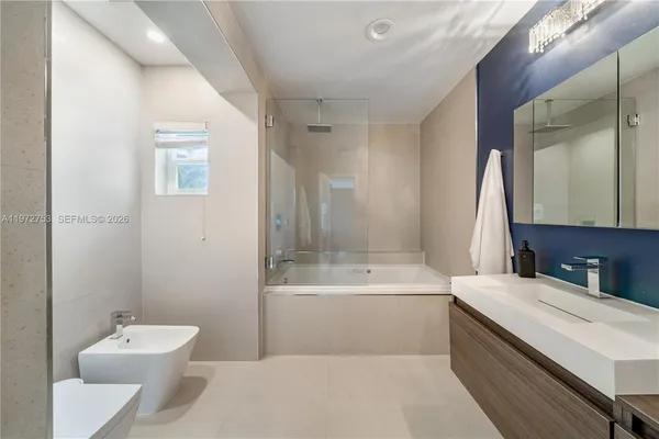 a bathroom with a sink a toilet and a bathtub