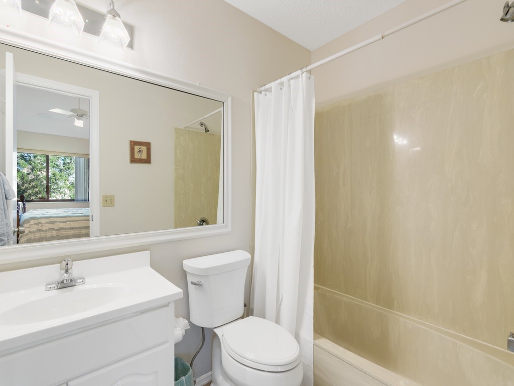 5735 Marina Drive, Unit 3 Sebastian, FL 32958 - Photo 11 of 36 a bathroom with a sink a toilet and shower