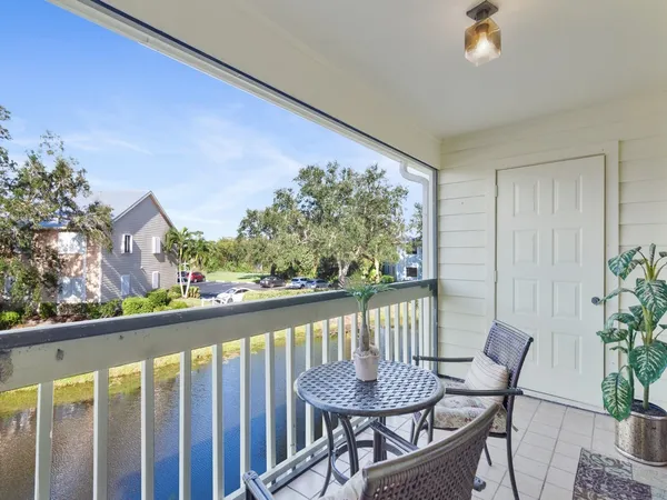 a view of a chairs and table in patio