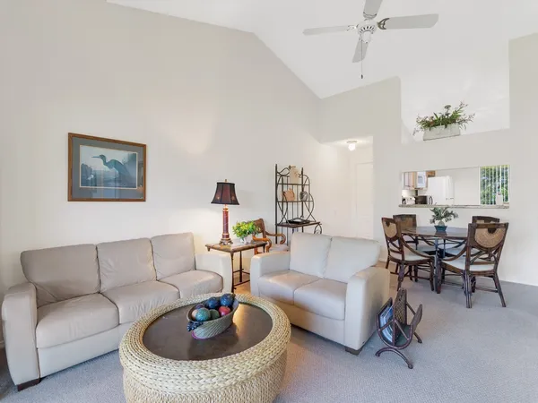 a living room with furniture and a rug