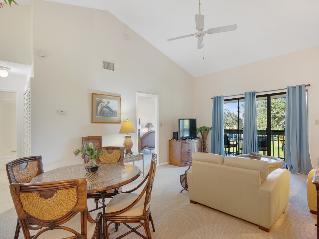 5735 Marina Drive, Unit 3 Sebastian, FL 32958 - Photo 5 of 36 a living room with furniture a table and chair with a potted plant