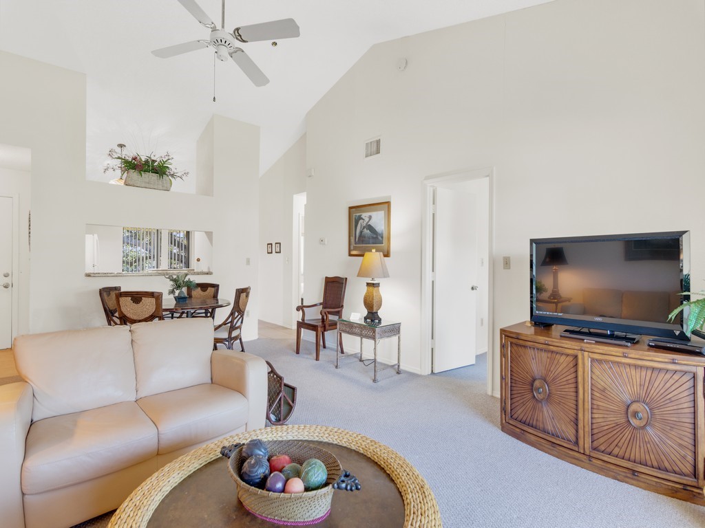 5735 Marina Drive, Unit 3 Sebastian, FL 32958 - Photo 6 of 36 a living room with furniture and a flat screen tv