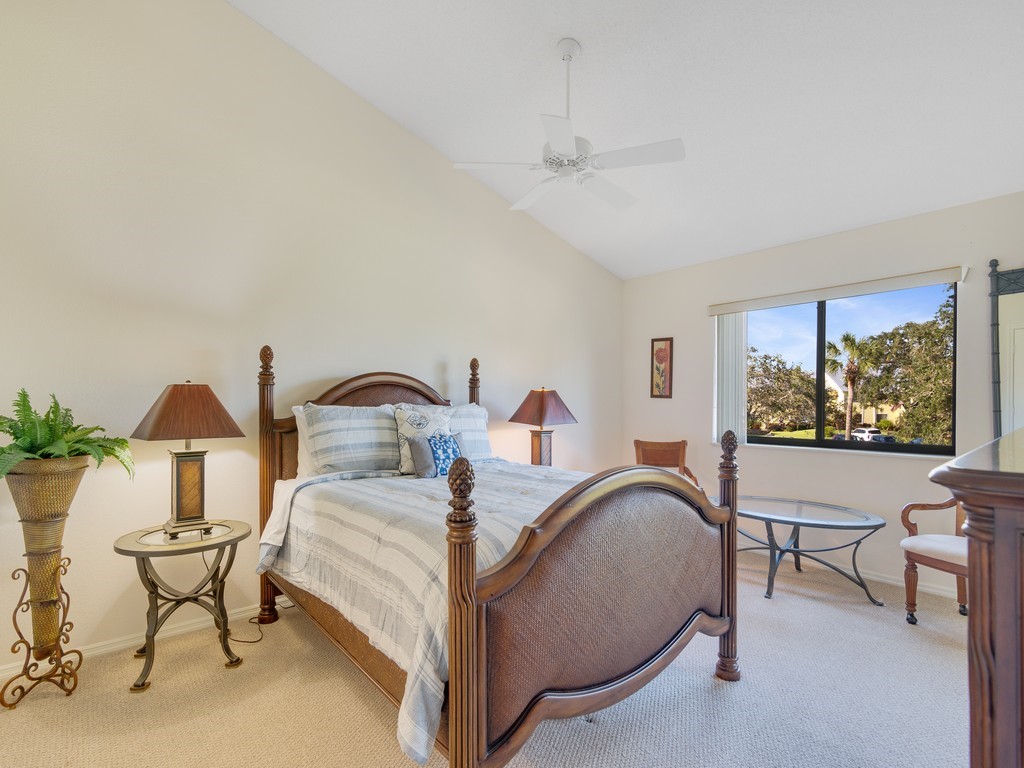 5735 Marina Drive, Unit 3 Sebastian, FL 32958 - Photo 9 of 36 a bedroom with a bed and a painting on the wall