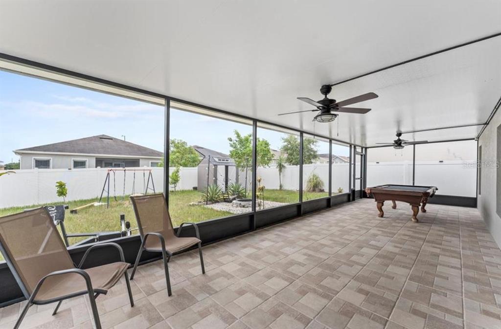 237 Tanager Street Haines City, FL 33844 - Photo 5 of 5 a view of chairs and table in the patio
