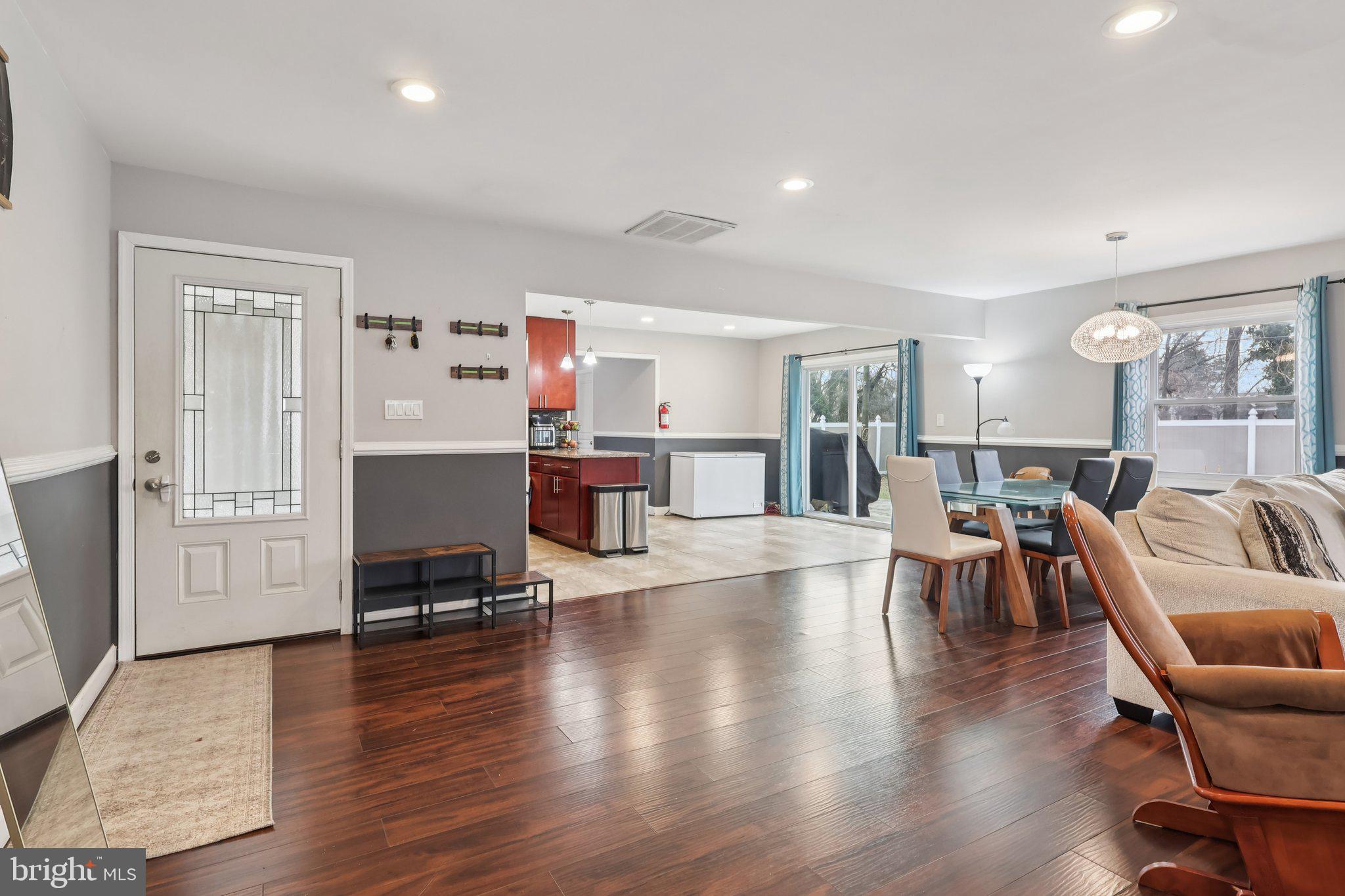 71 Harrington Circle Willingboro, NJ 08046 - Photo 8 of 37 a living room with fireplace furniture and a wooden floor