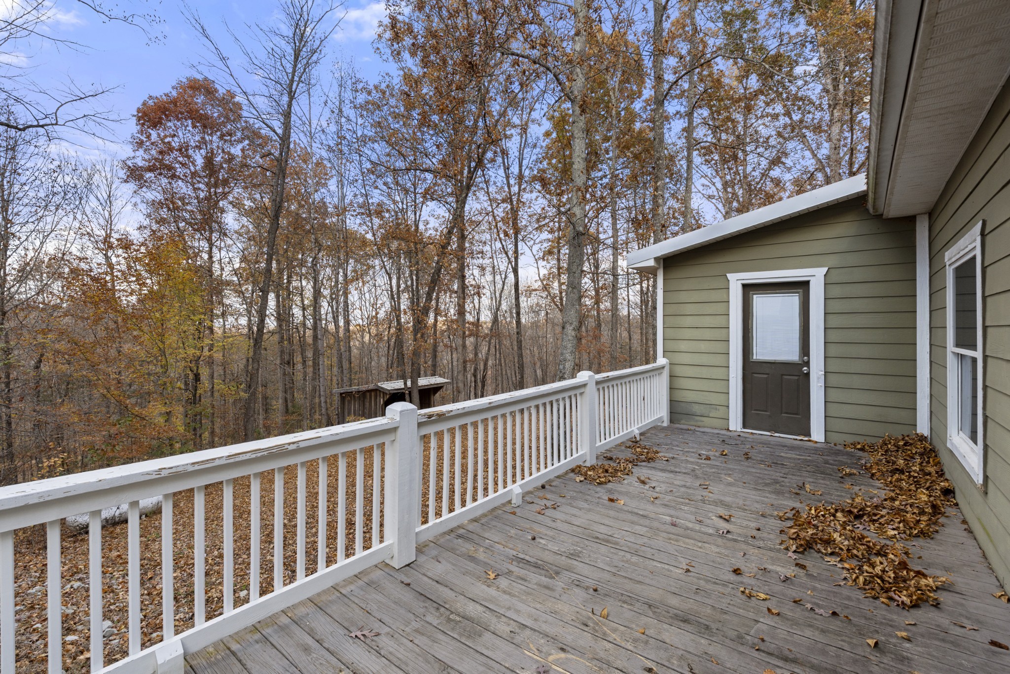 1148 Stoltz Road Centerville, TN 37033 - Photo 13 of 52 a view of a wooden house with a large window