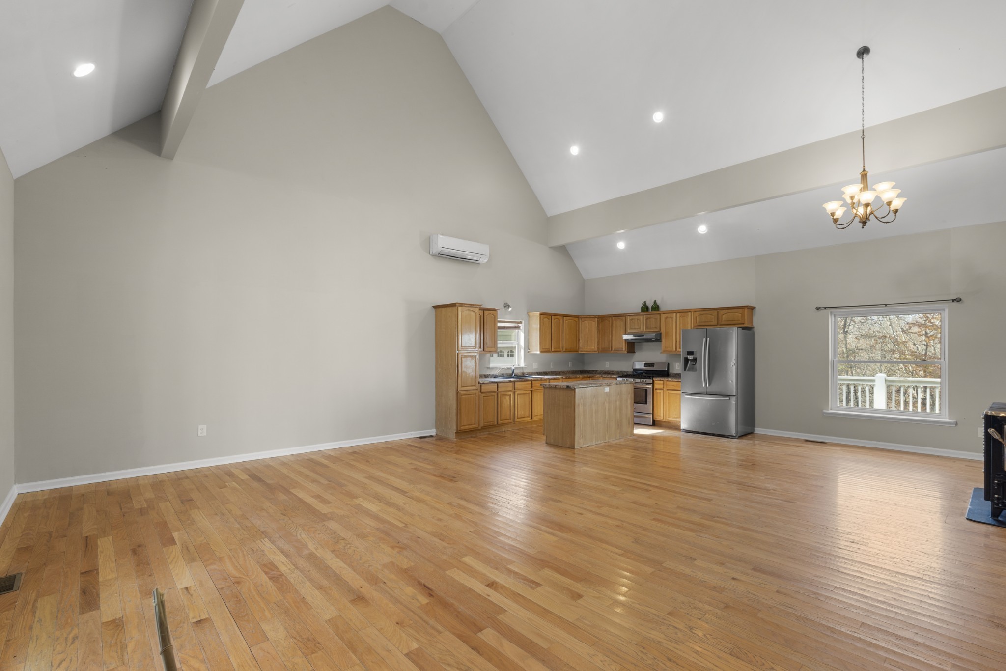 1148 Stoltz Road Centerville, TN 37033 - Photo 17 of 52 a view of a kitchen with kitchen island wooden floor appliances and a window