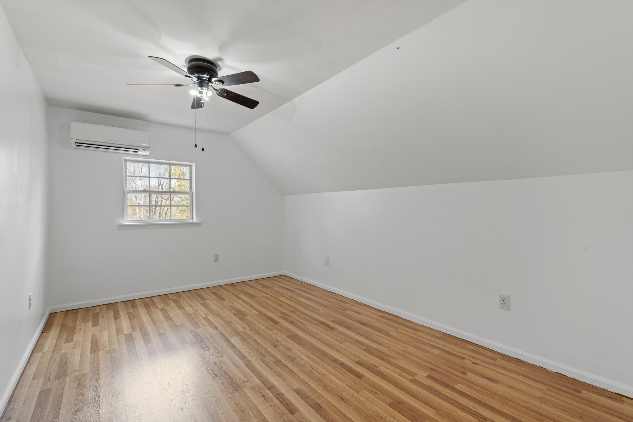 1148 Stoltz Road Centerville, TN 37033 - Photo 18 of 52 a view of empty room with wooden floor and fan
