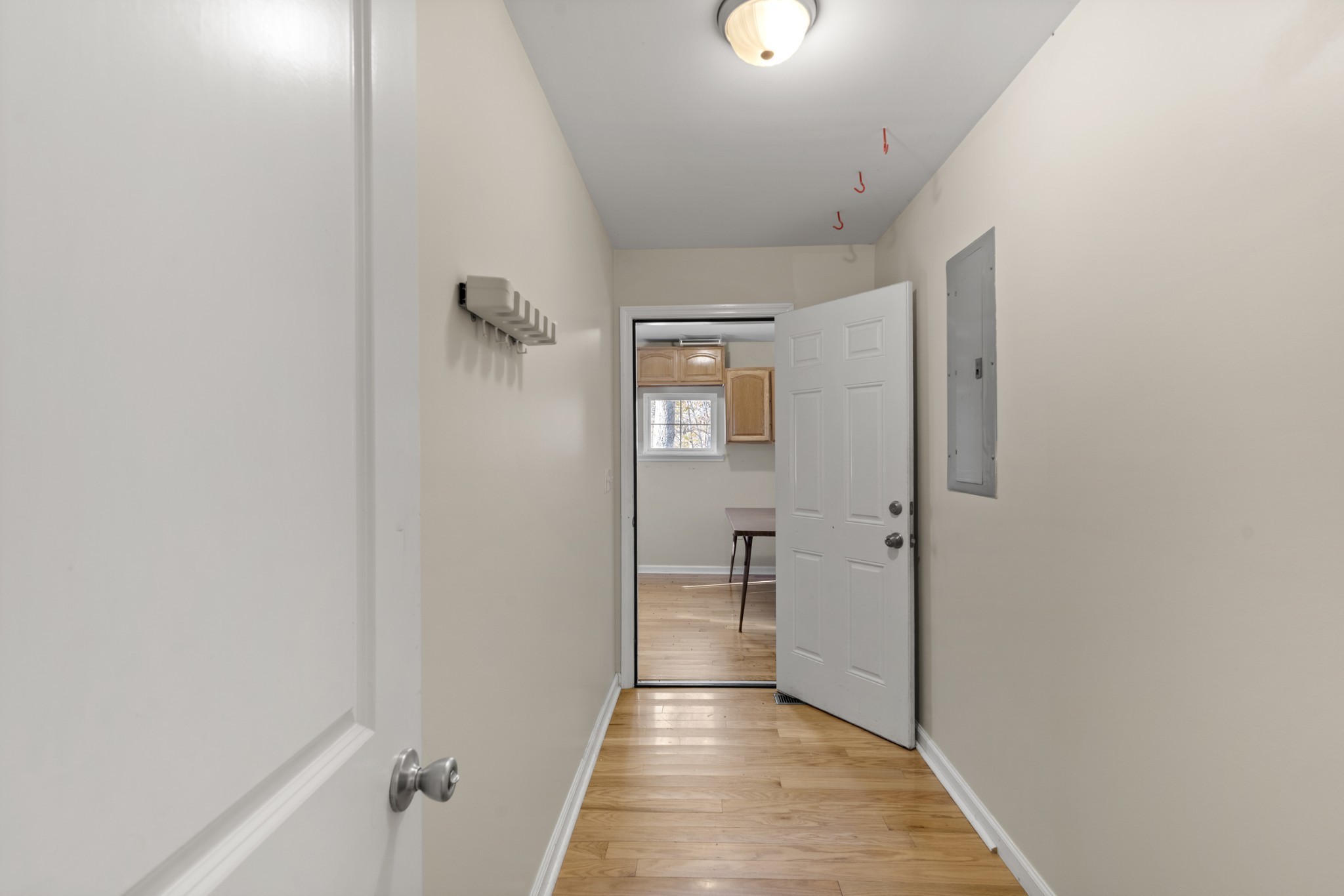 1148 Stoltz Road Centerville, TN 37033 - Photo 28 of 52 a view of a hallway with wooden floor and a bathroom