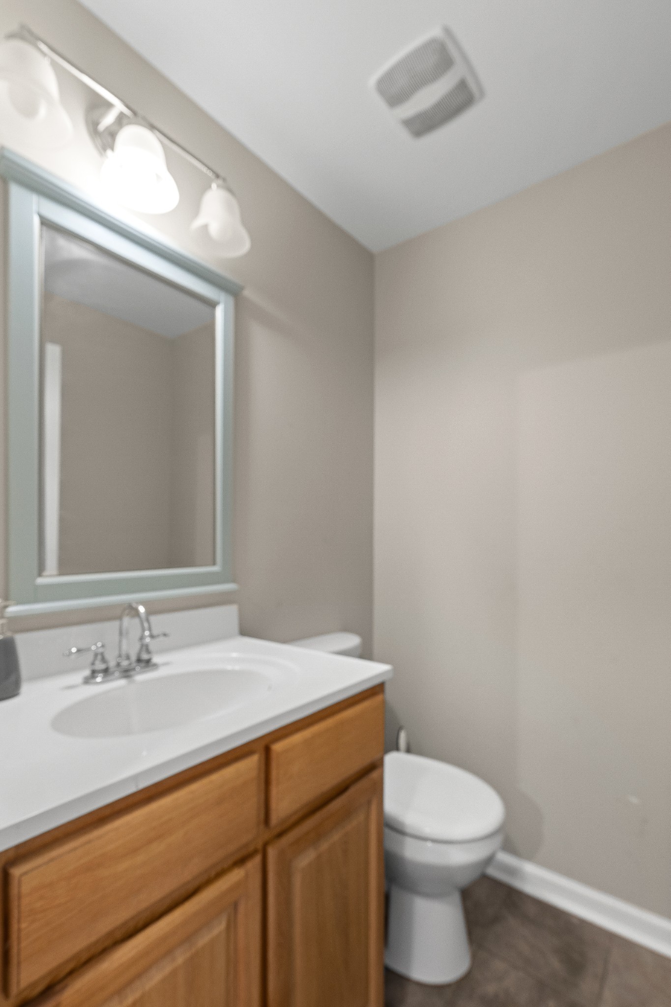 1148 Stoltz Road Centerville, TN 37033 - Photo 30 of 52 a bathroom with a sink a toilet and mirror