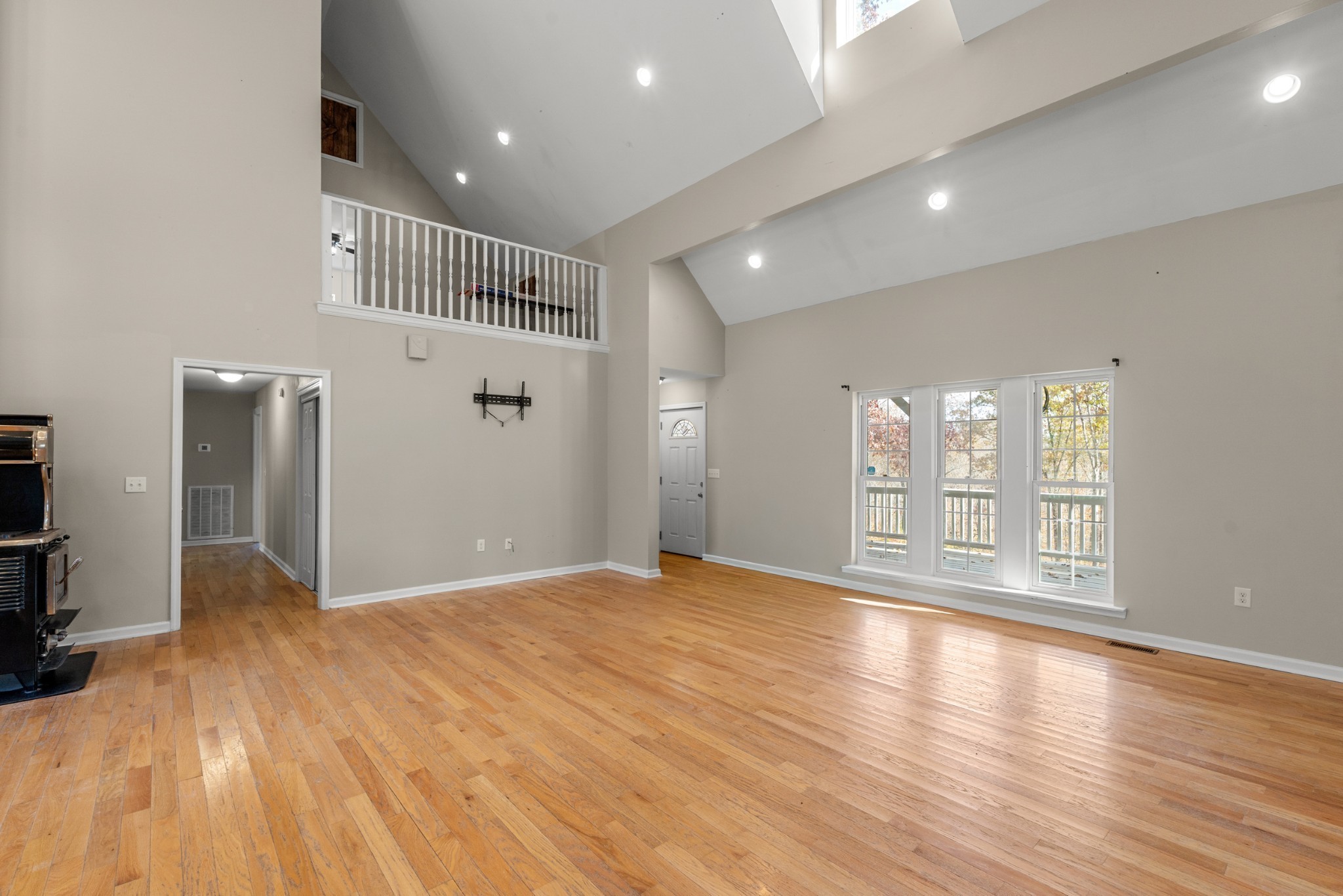 1148 Stoltz Road Centerville, TN 37033 - Photo 4 of 52 a view of an empty room with wooden floor and a window