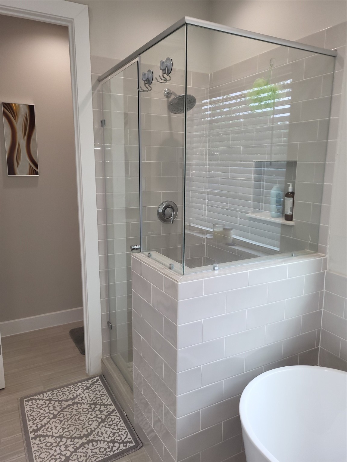 240 Julia Street, Unit A Houston, TX 77022 - Photo 23 of 36 And to the right there is a separate soaking tub and shower enclosure with dual shower heads.