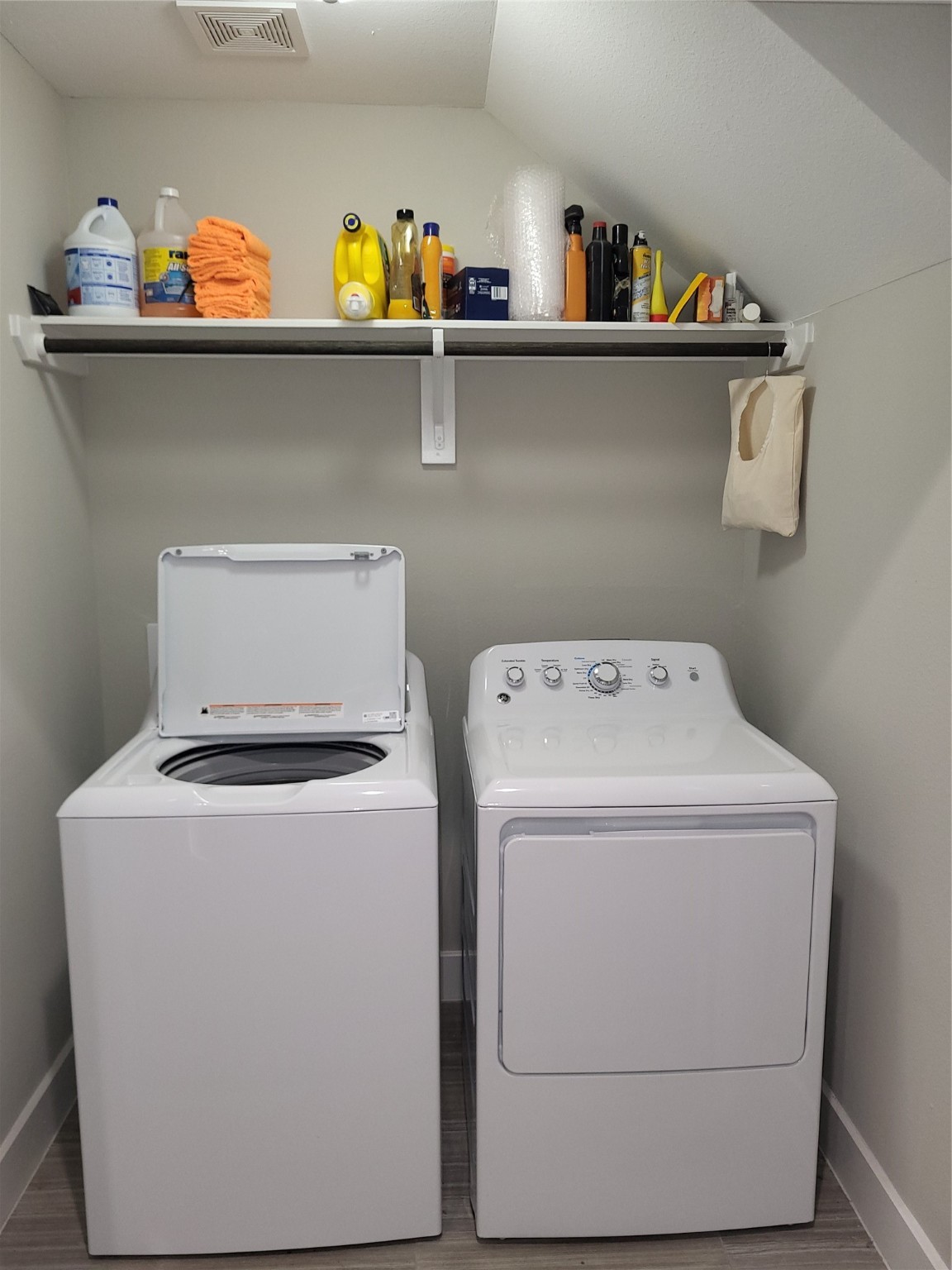 240 Julia Street, Unit A Houston, TX 77022 - Photo 29 of 36 The utility room with laundry and dryer is just opposite the garage door.