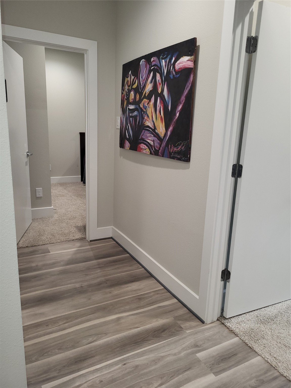 240 Julia Street, Unit A Houston, TX 77022 - Photo 31 of 36 There's a small hallway between the two downstairs bedrooms.