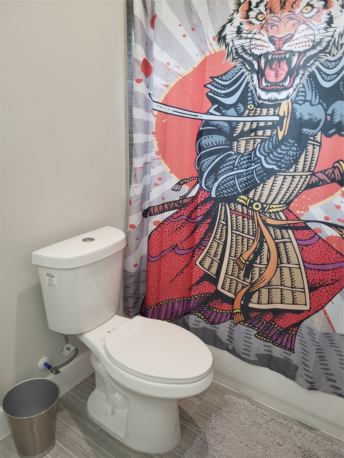 240 Julia Street, Unit A Houston, TX 77022 - Photo 34 of 36 A view of the full bathroom downstairs with tub and shower combo. Each bedroom includes barn doors to enter the shared bathroom.