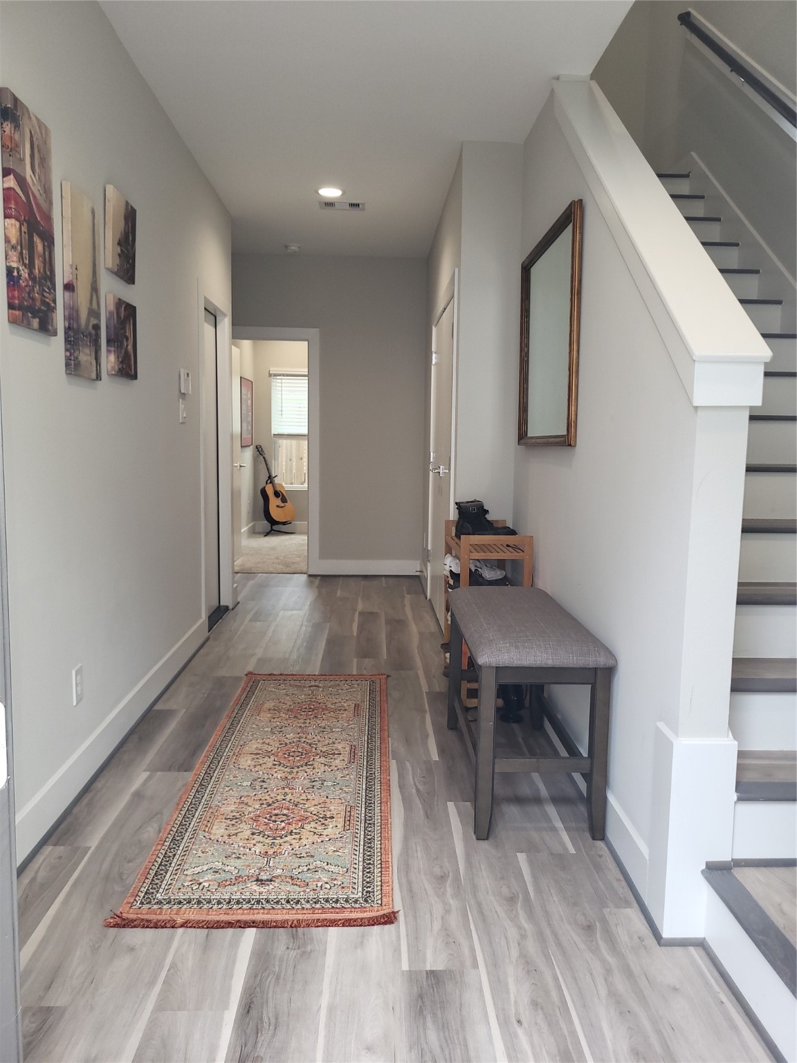 240 Julia Street, Unit A Houston, TX 77022 - Photo 4 of 36 Your view as you enter the home. The stairs on the right lead to the open concept living room and kitchen/dining area.