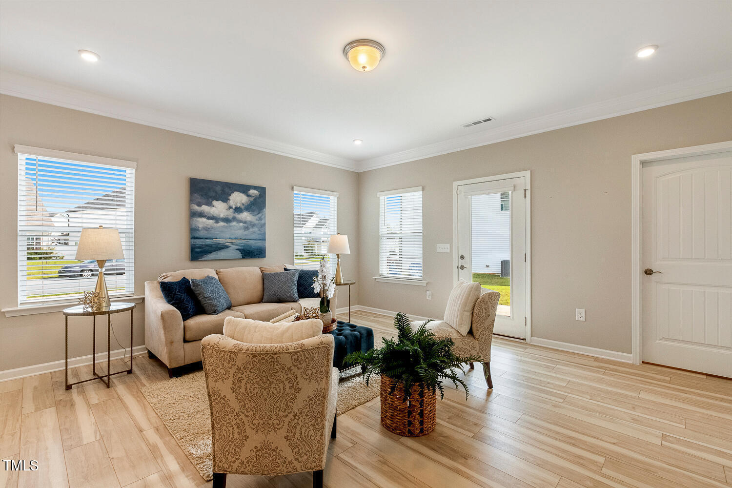 5116 Farm Barn Lane Raleigh, NC 27603 - Photo 17 of 45 a living room with furniture and wooden floor