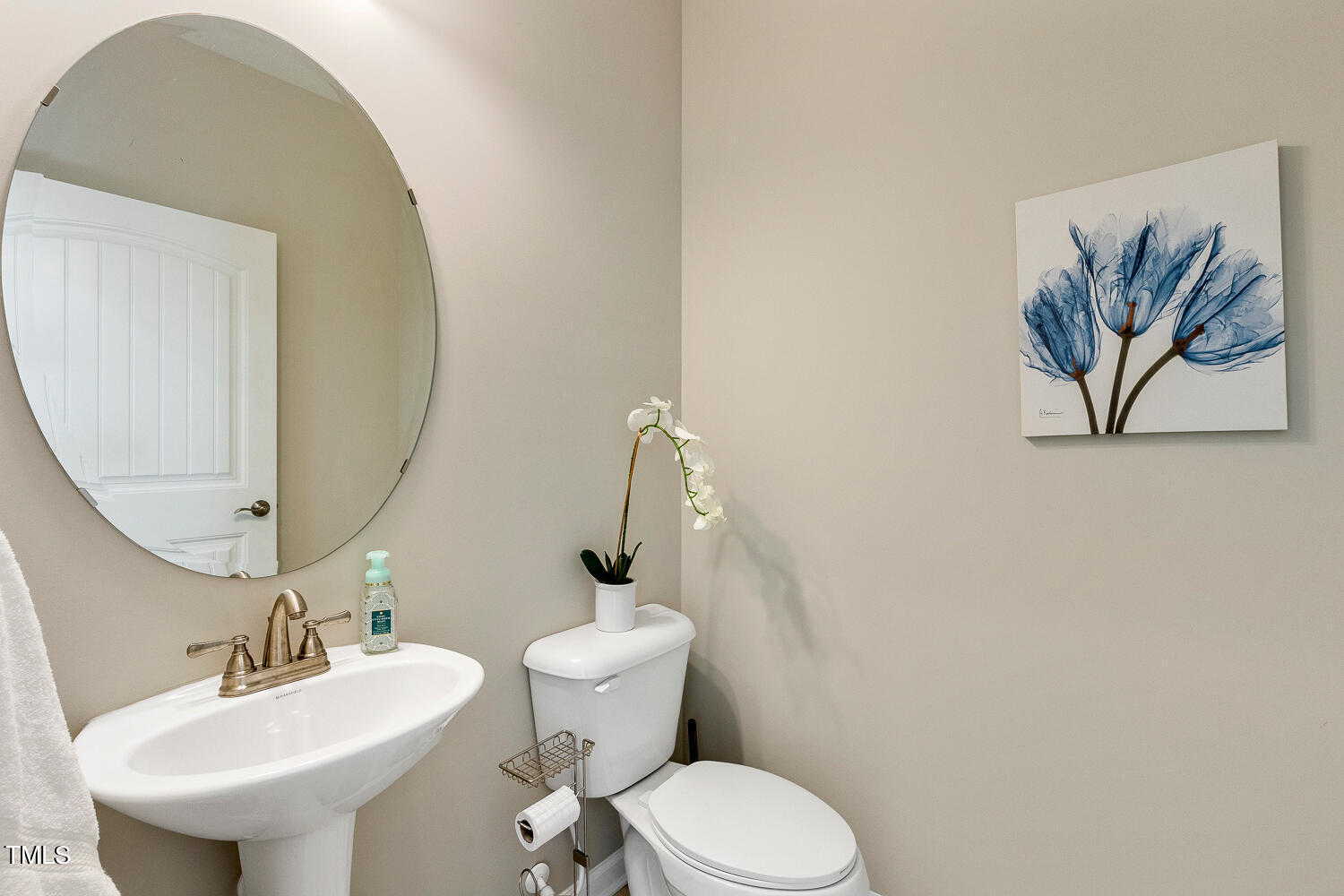 5116 Farm Barn Lane Raleigh, NC 27603 - Photo 19 of 45 a bathroom with a toilet a sink and mirror
