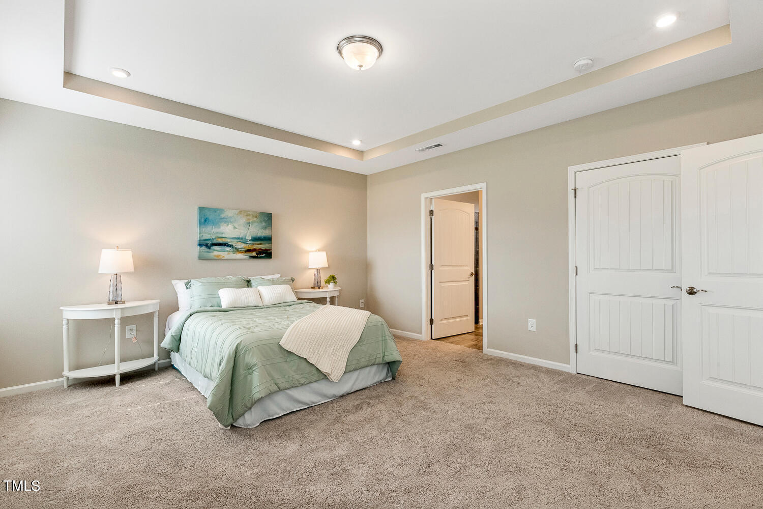 5116 Farm Barn Lane Raleigh, NC 27603 - Photo 22 of 45 a spacious bedroom with a bed and a lamp