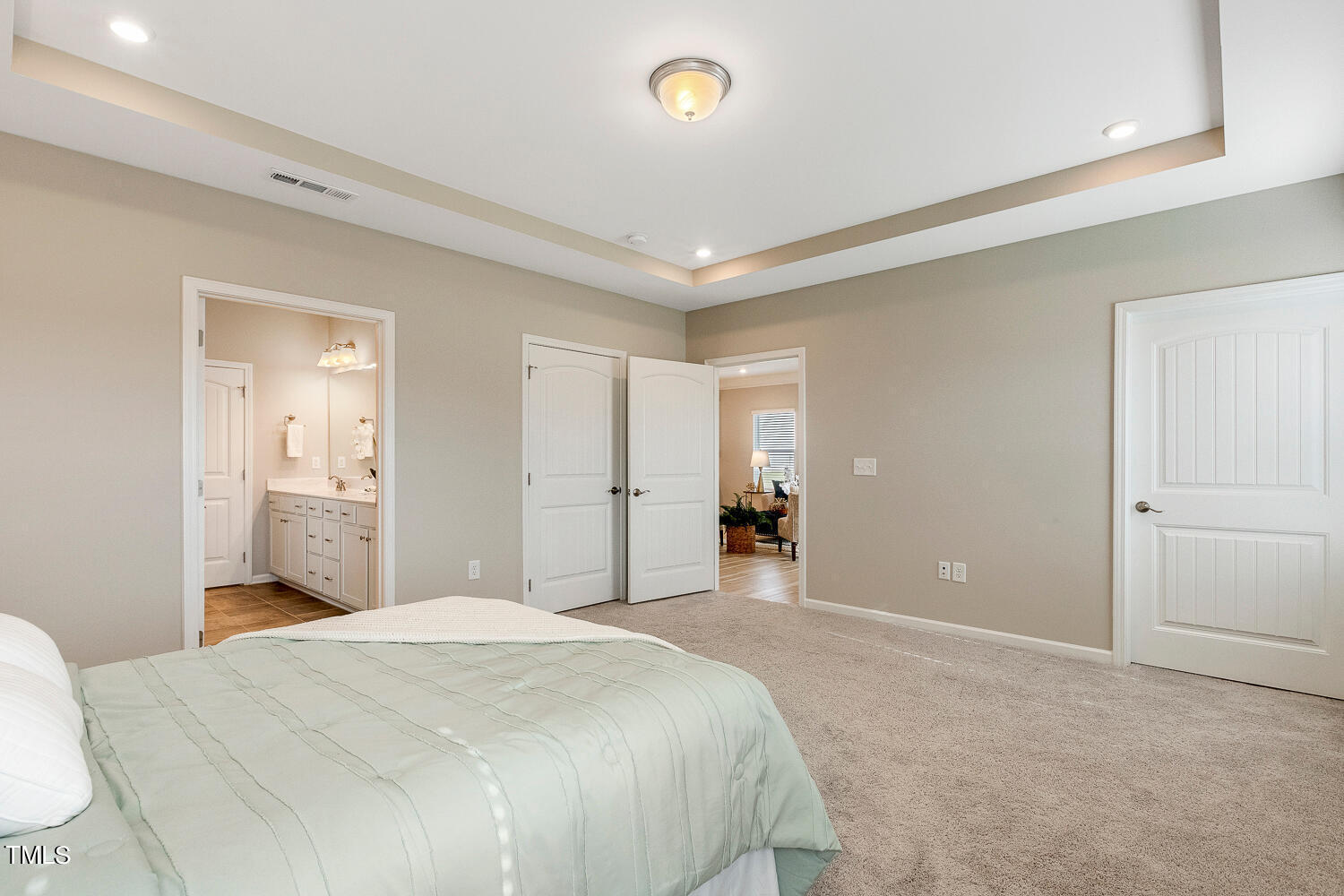 5116 Farm Barn Lane Raleigh, NC 27603 - Photo 23 of 45 a bedroom with a bed and a mirror