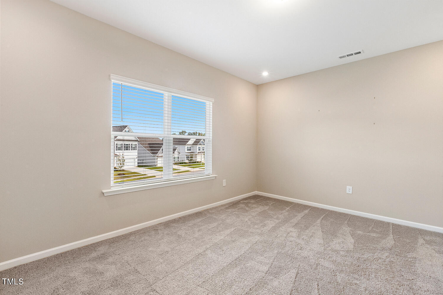 5116 Farm Barn Lane Raleigh, NC 27603 - Photo 29 of 45 a view of an empty room with a window