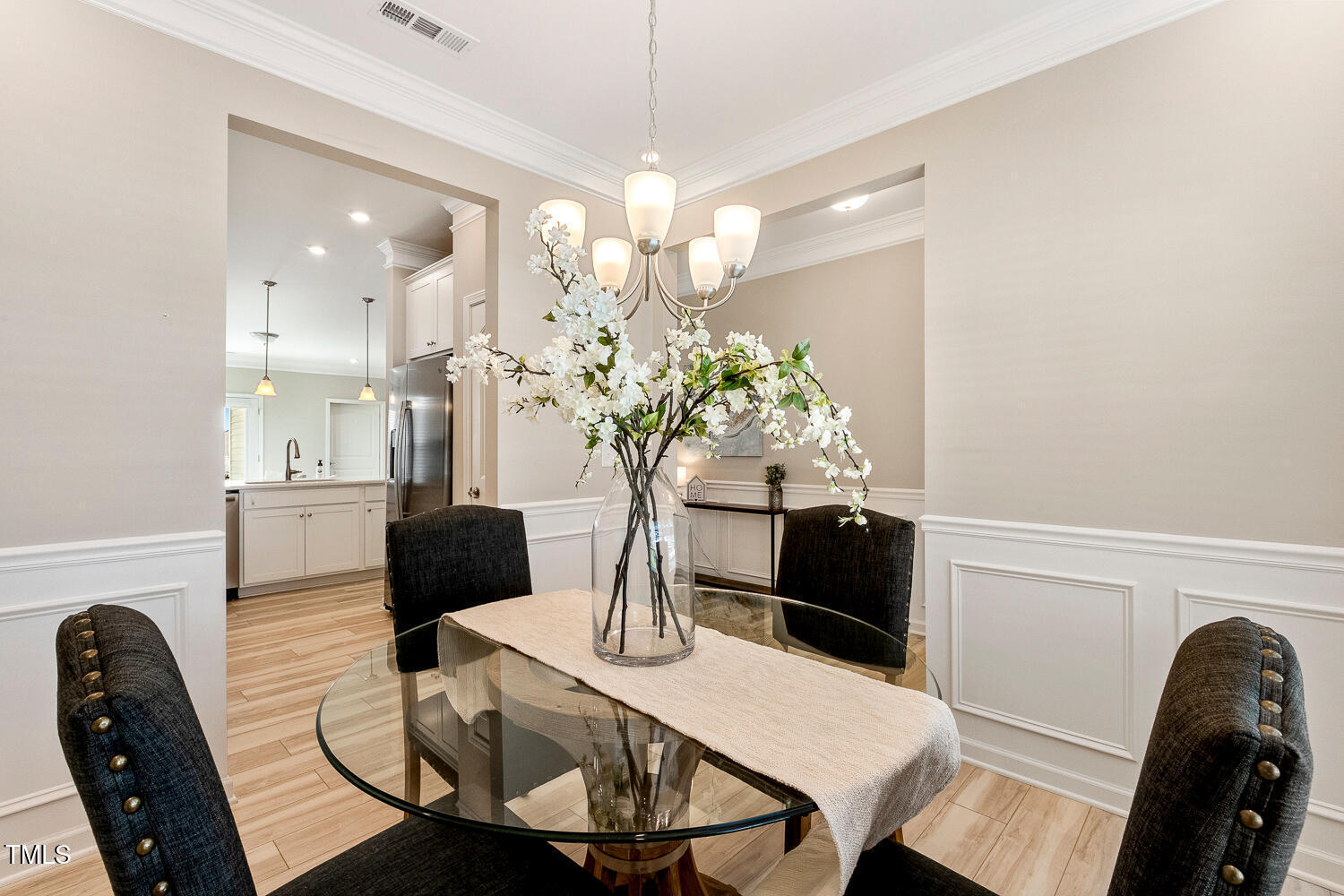 5116 Farm Barn Lane Raleigh, NC 27603 - Photo 8 of 45 a living room with furniture and a chandelier