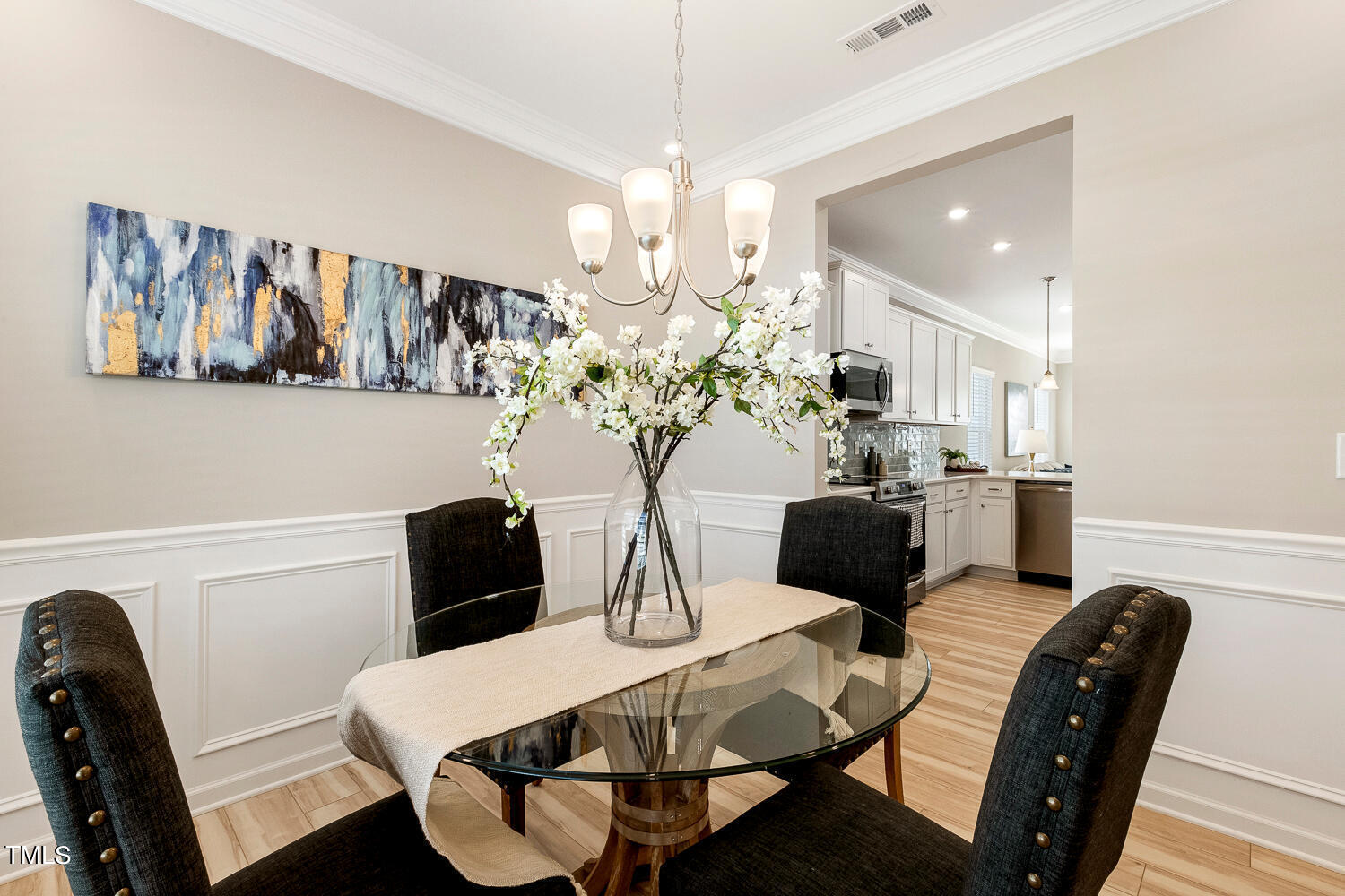 5116 Farm Barn Lane Raleigh, NC 27603 - Photo 9 of 45 a view of a dining room with furniture and wooden floor