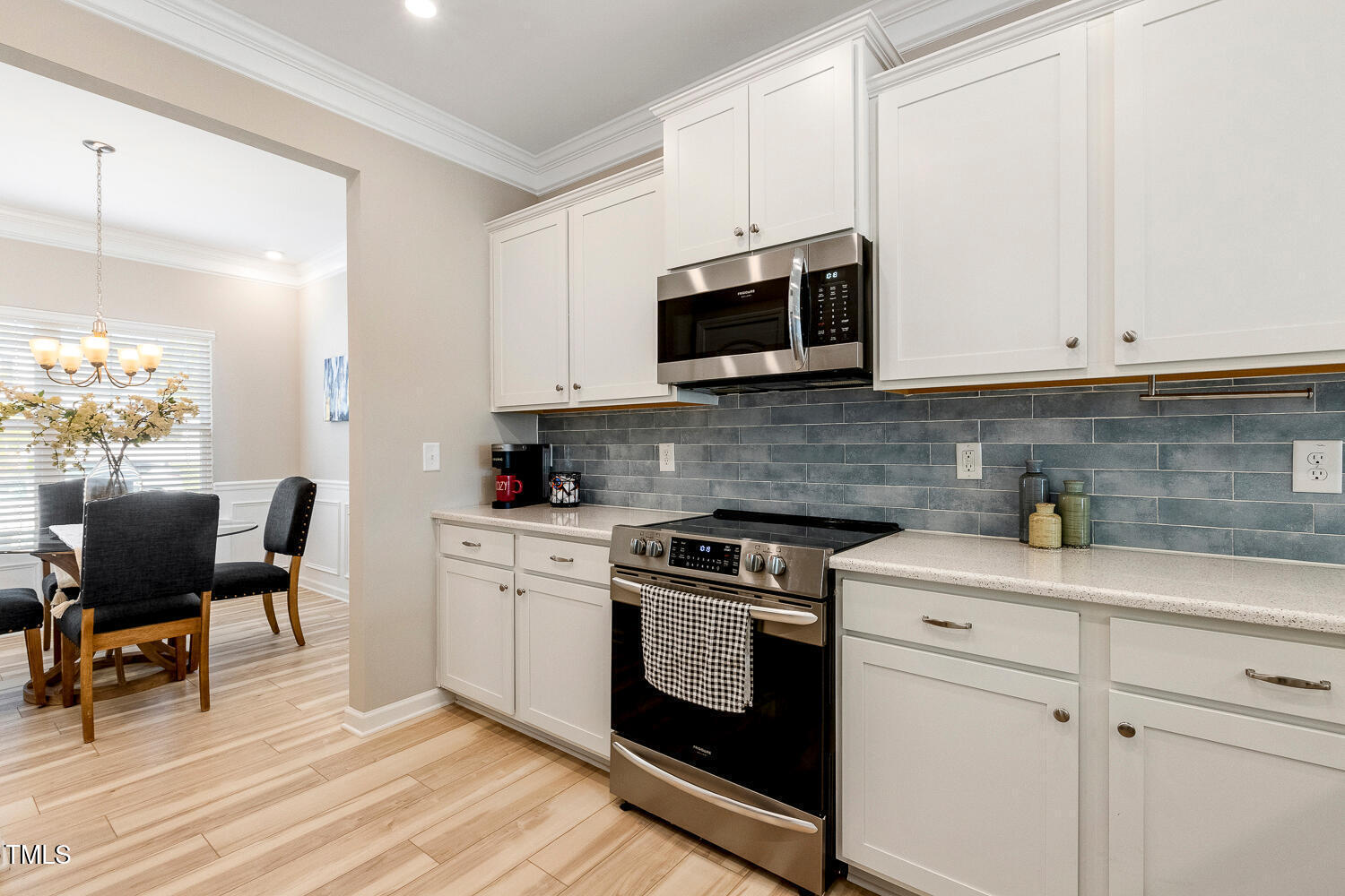 5116 Farm Barn Lane Raleigh, NC 27603 - Photo 10 of 45 a kitchen with stainless steel appliances granite countertop a stove a sink and a microwave