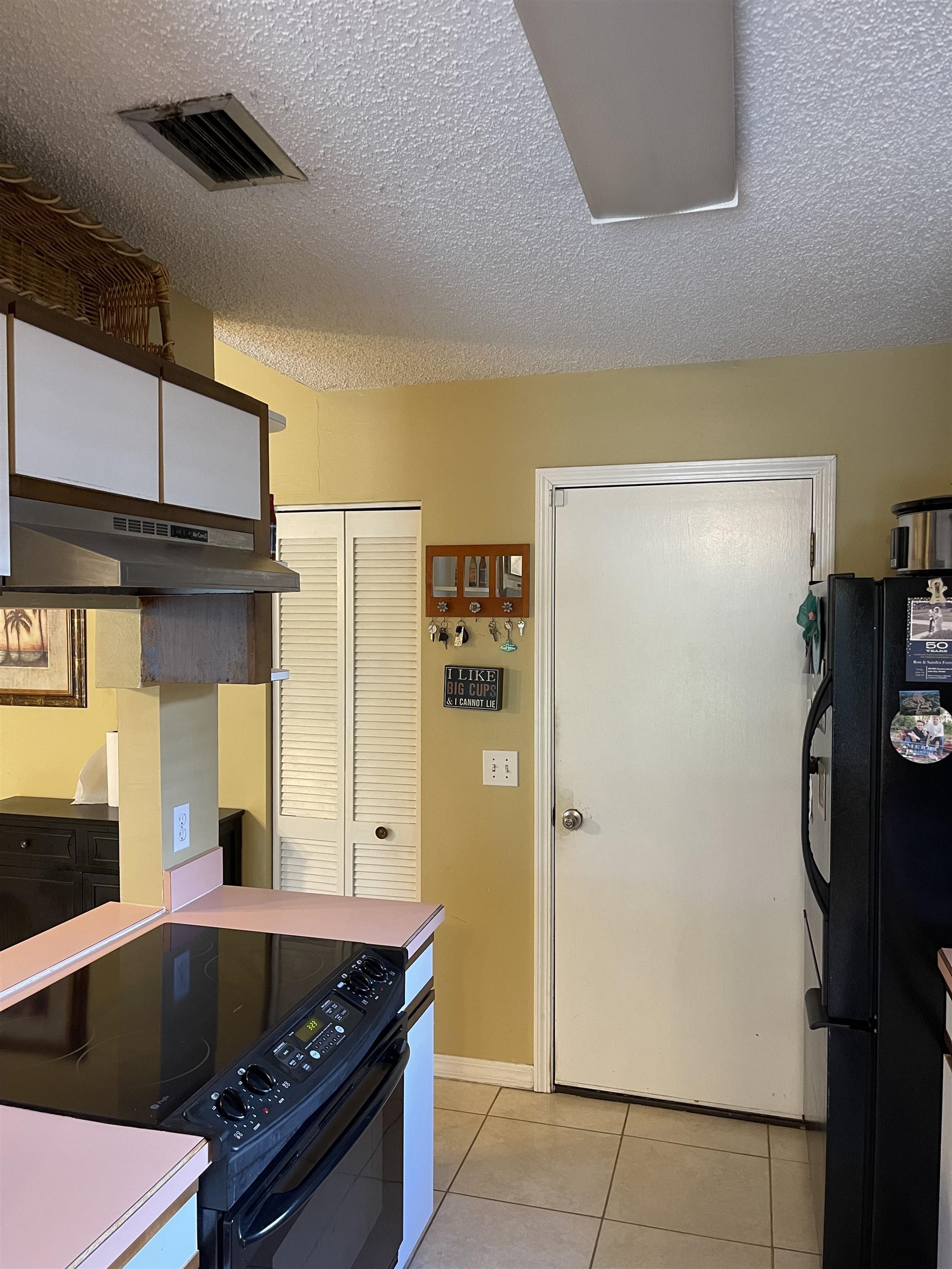 209 Gerona Road St. Augustine, FL 32086 - Photo 4 of 23 a kitchen with stainless steel appliances granite countertop a refrigerator and a stove