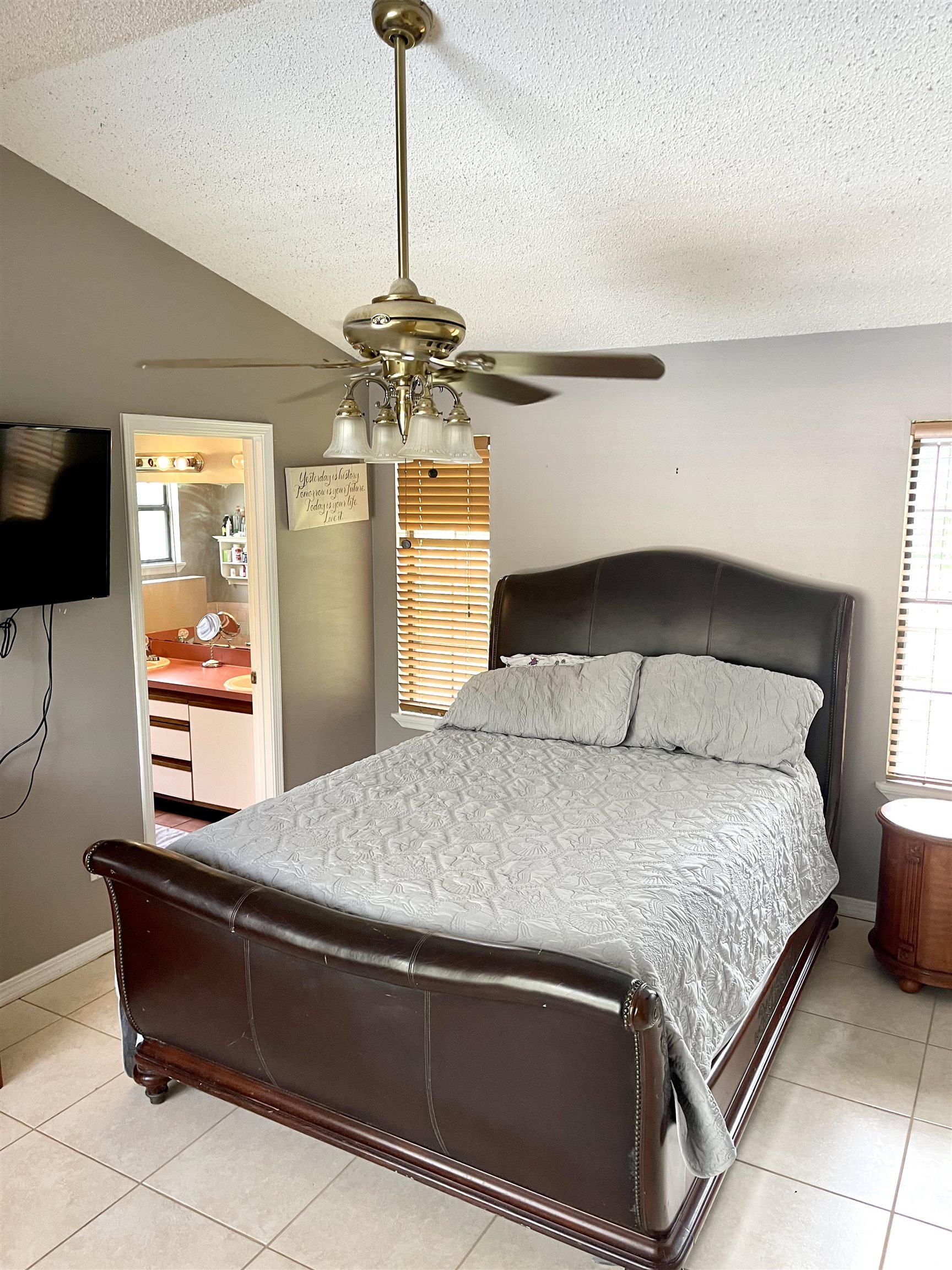 209 Gerona Road St. Augustine, FL 32086 - Photo 9 of 23 a bedroom with a bed and a chandelier