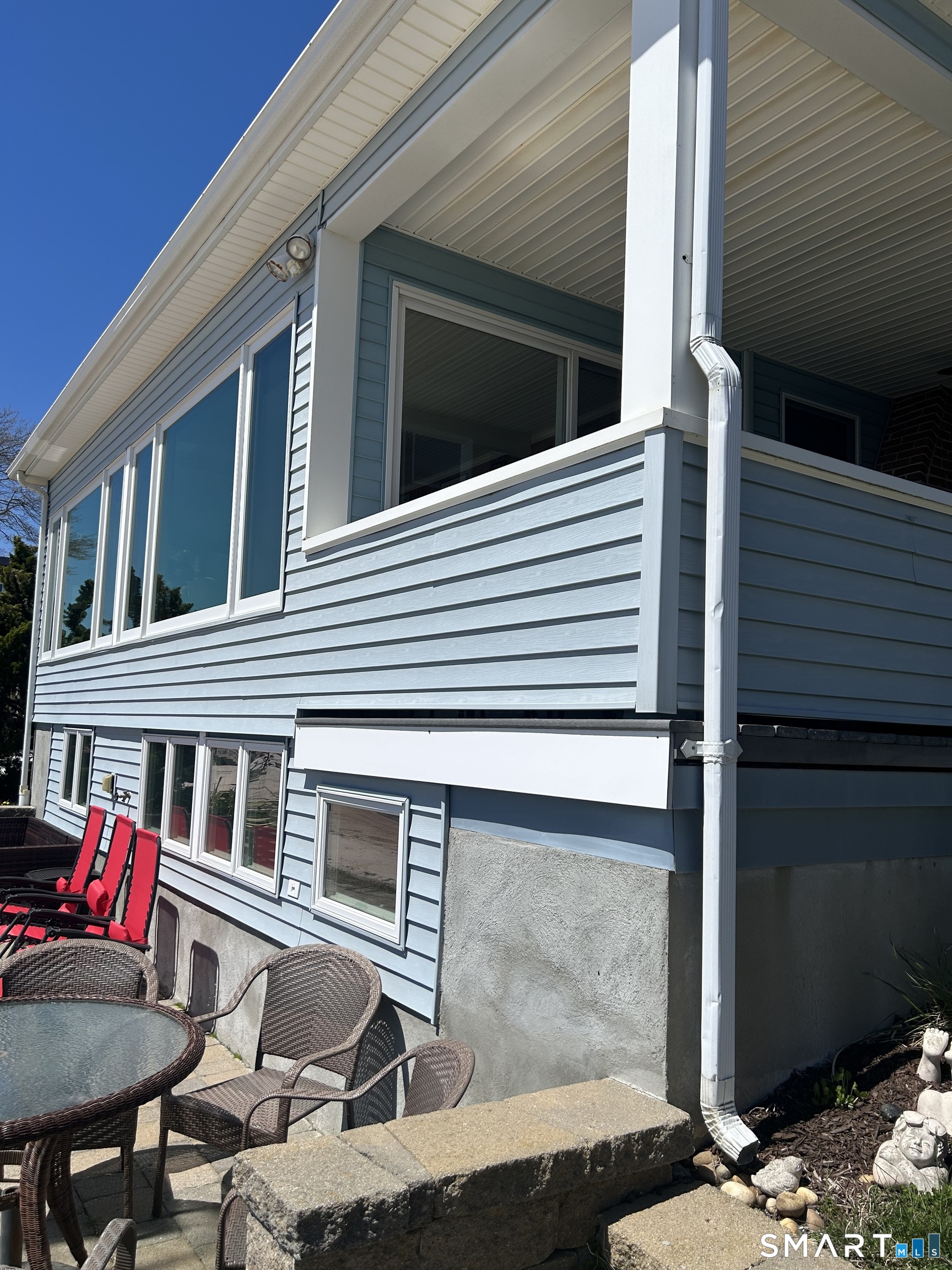 293 Giants Neck Road East Lyme, CT 06357 - Photo 8 of 21 a view of a house with a patio